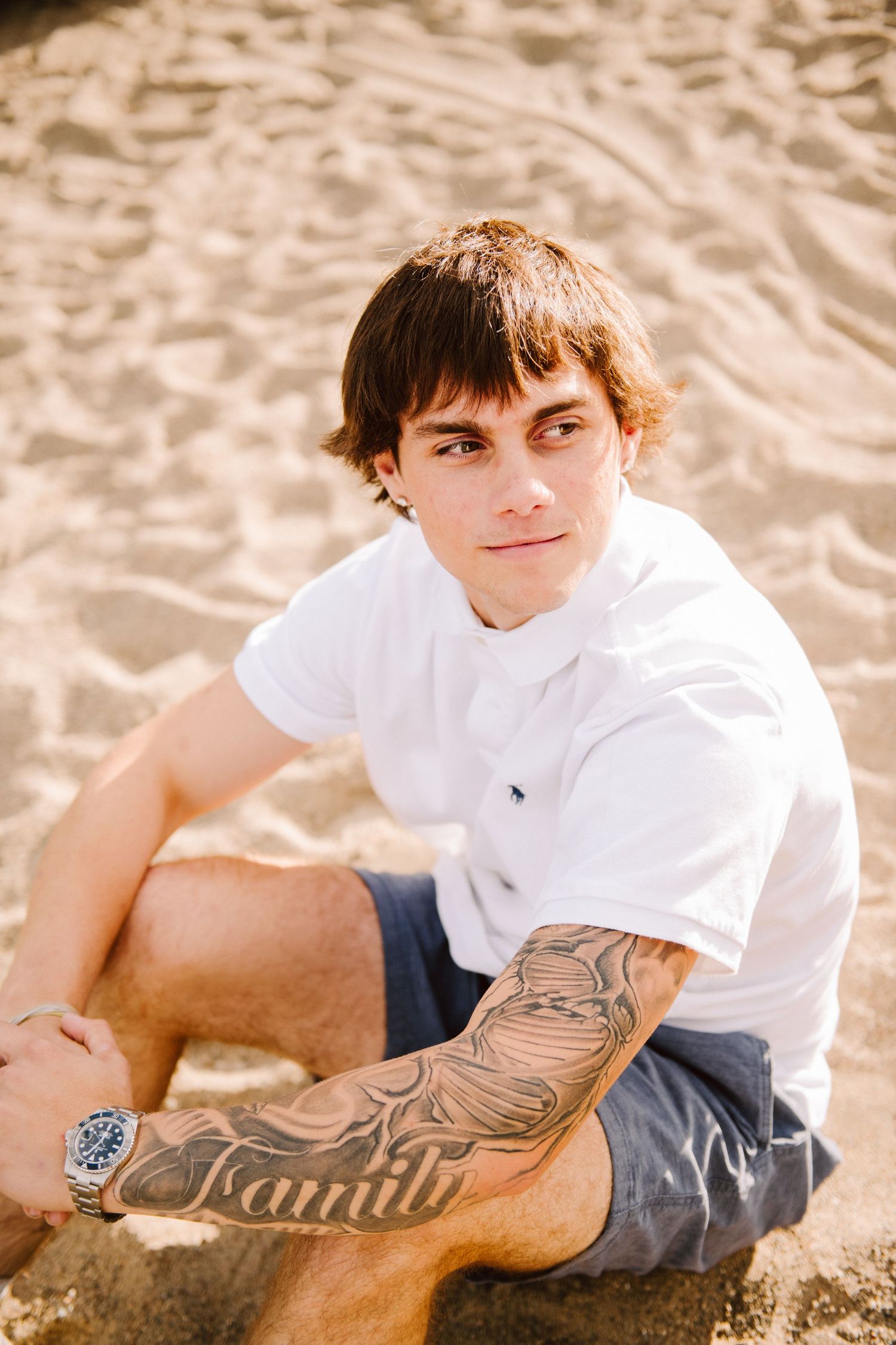 high school senior guy on beach