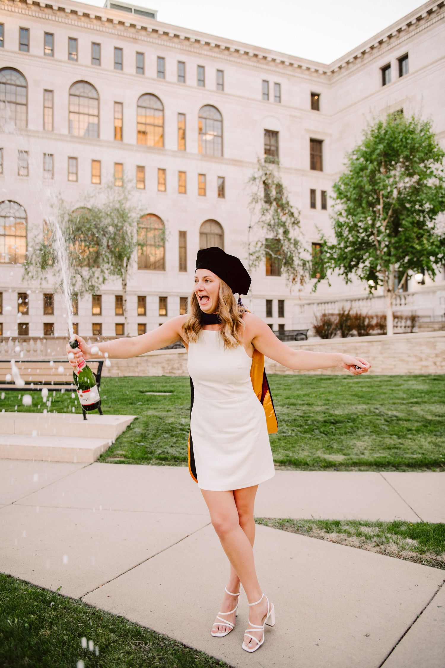 law school graduation photos popping champagne