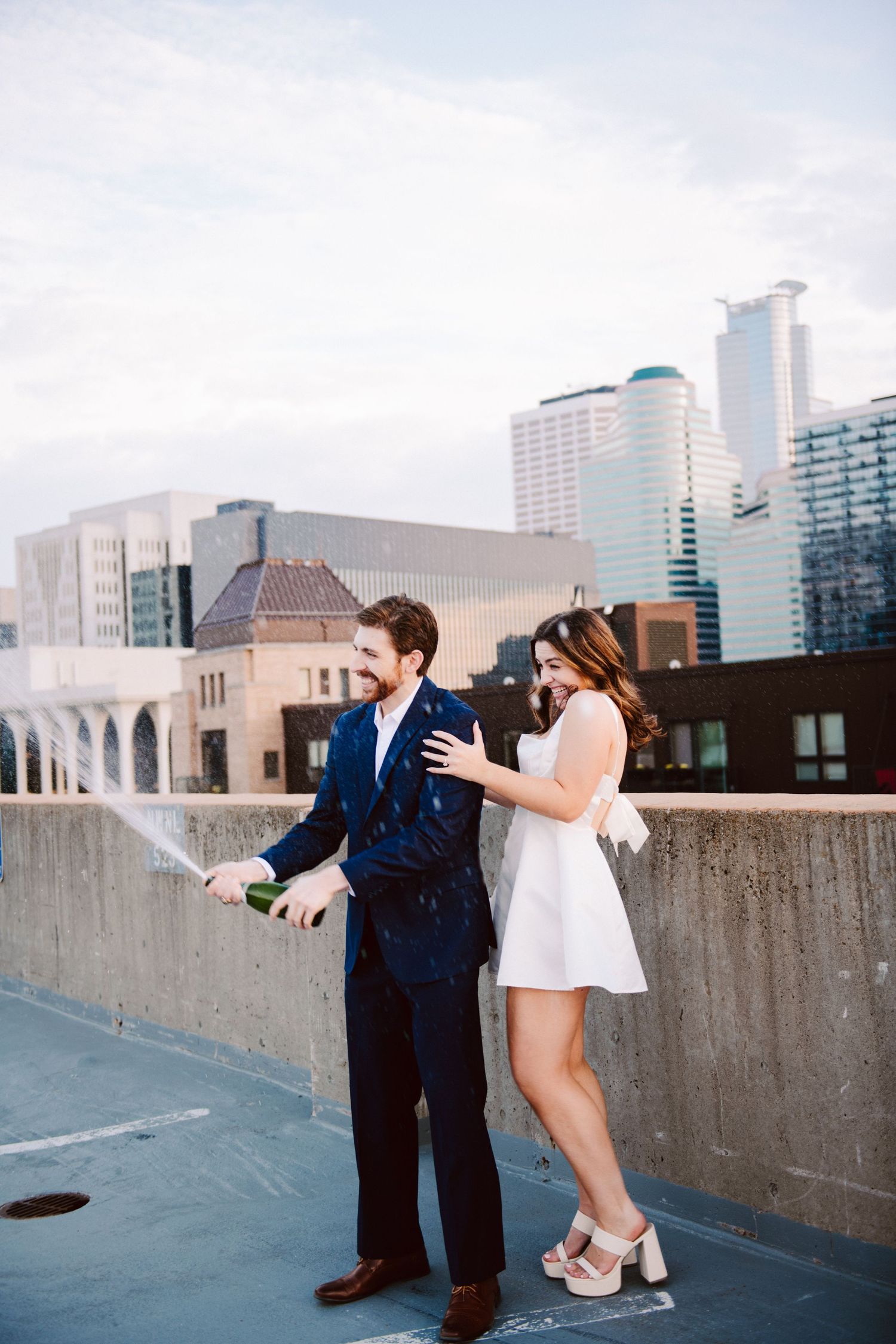 engagement pictures with champagne pop