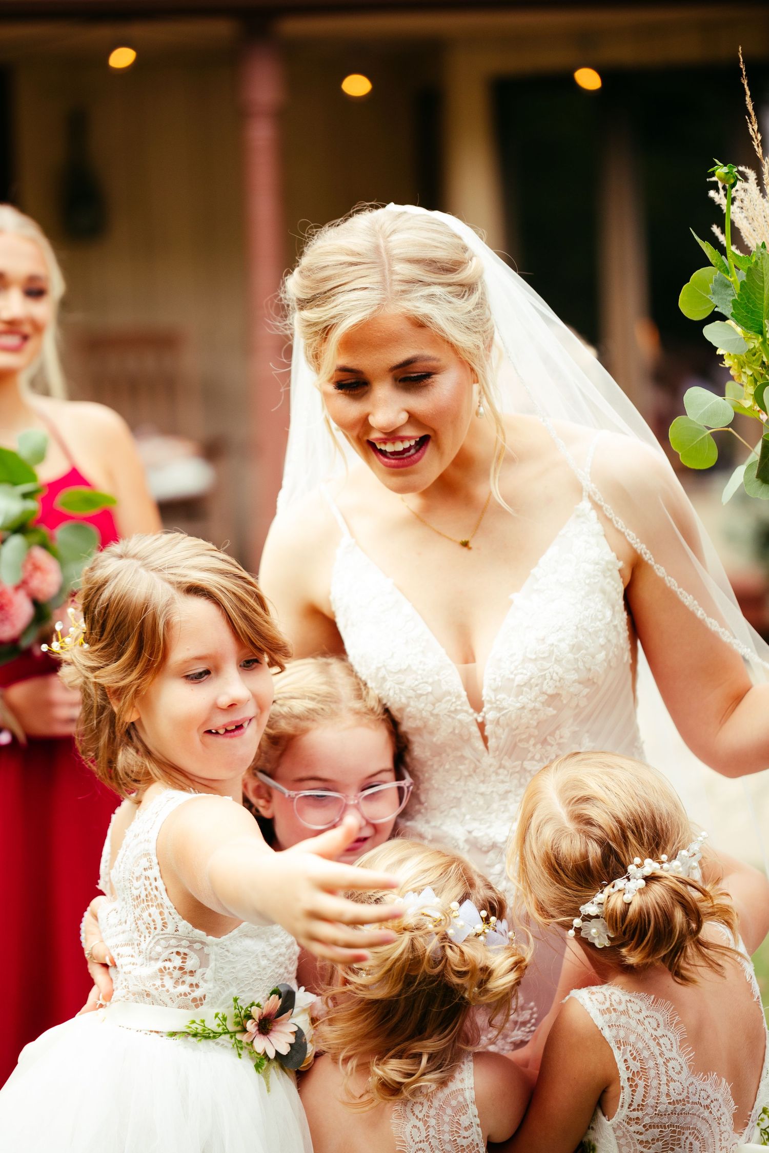 bride picture with flower girls