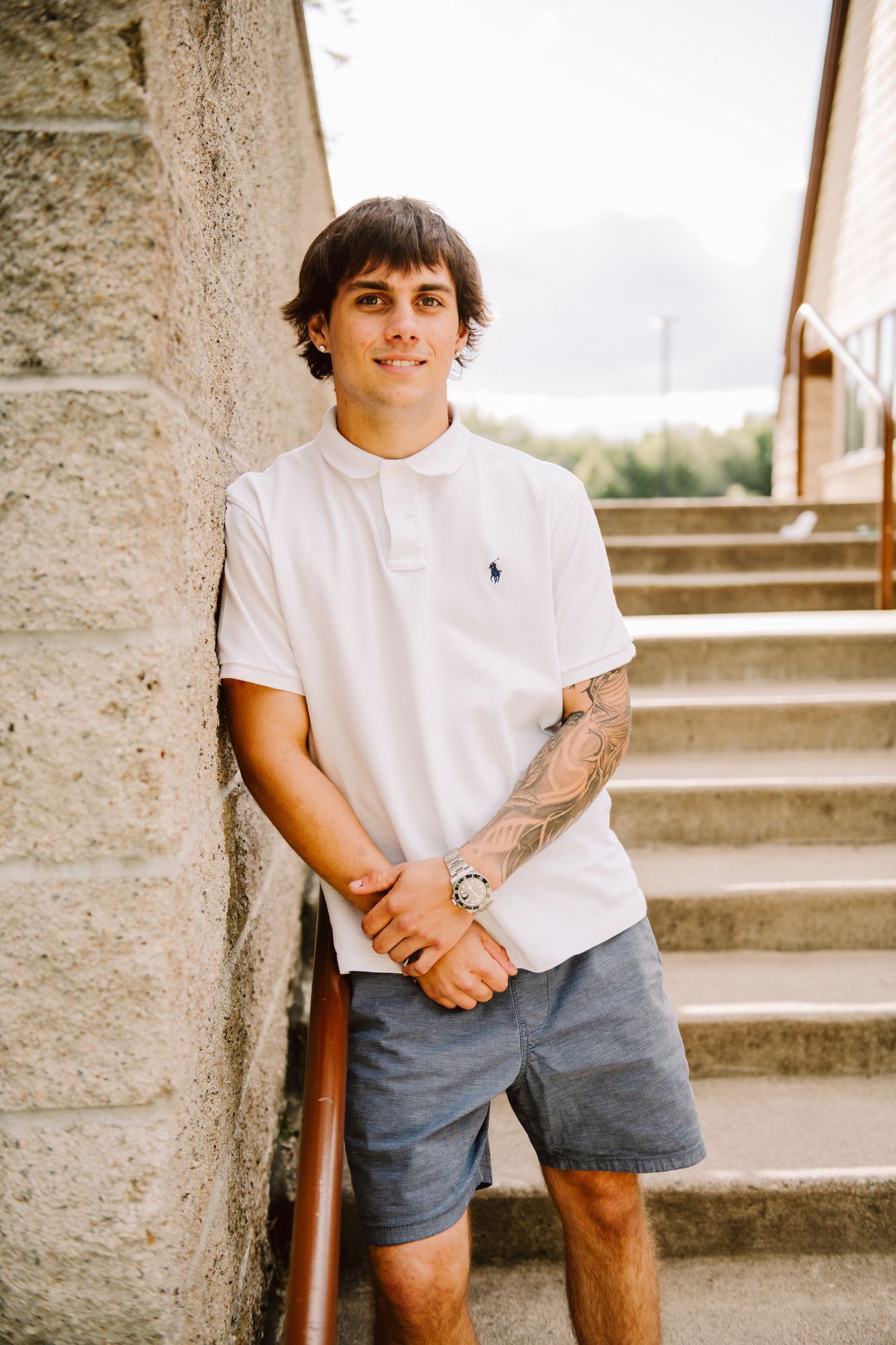 high school senior guy on stairs