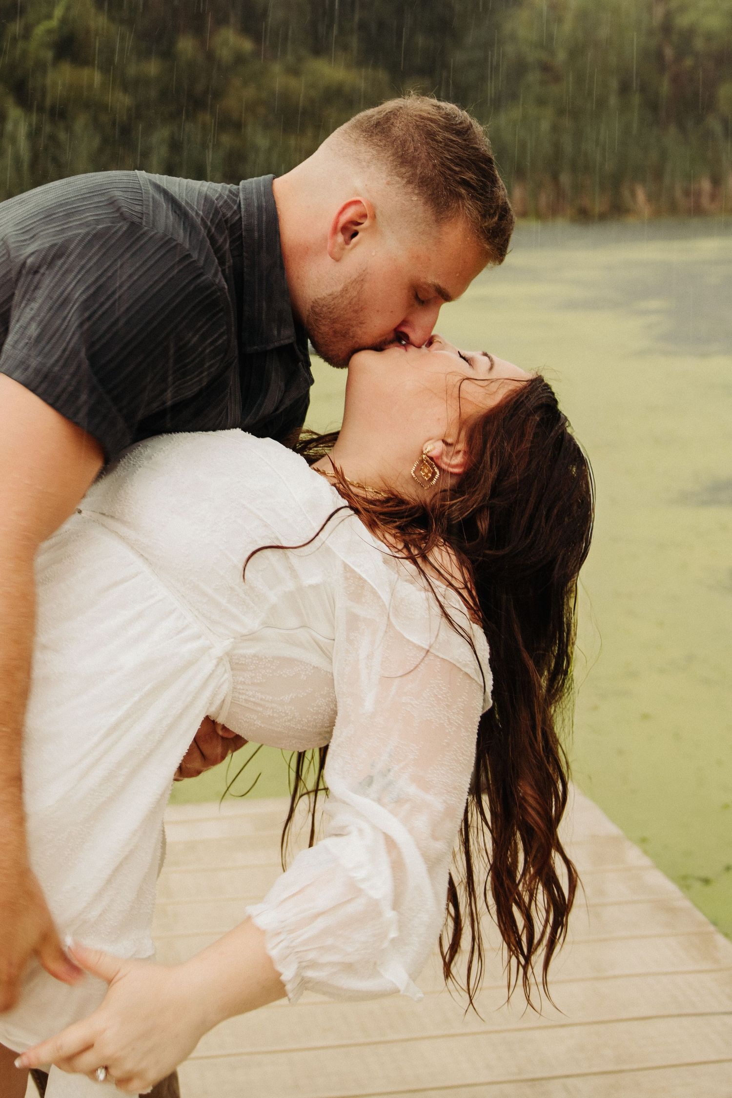 couple in engagement pictures on dock