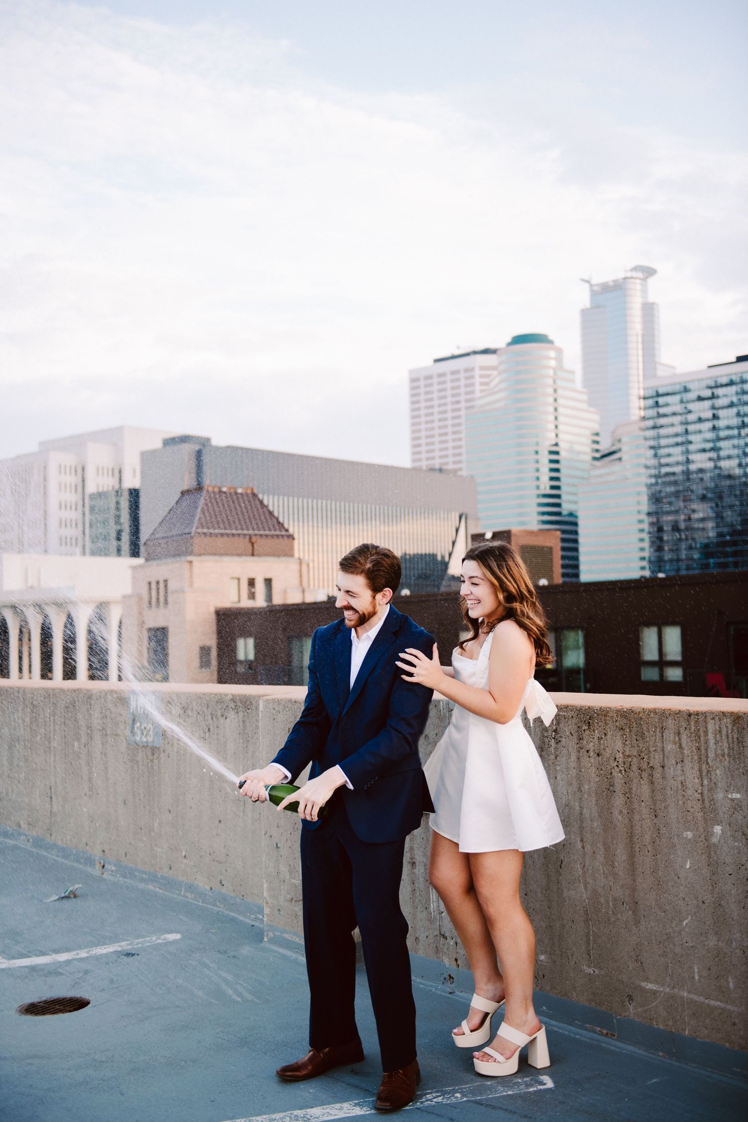 engagement pictures with champagne pop