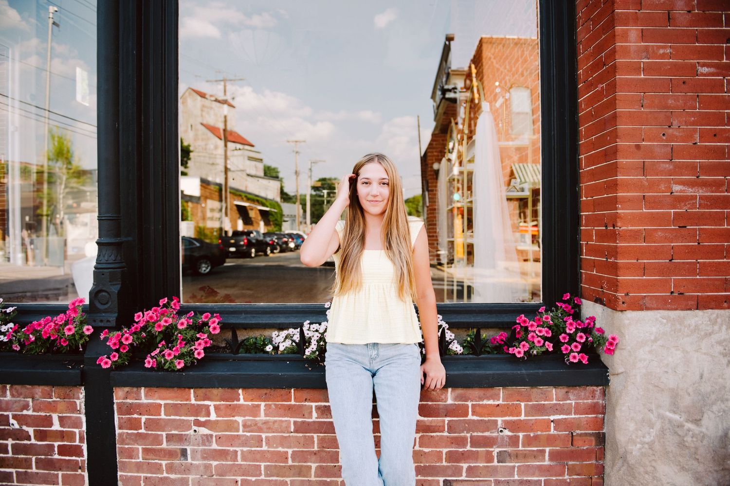 high school senior girl pictures leaning against window