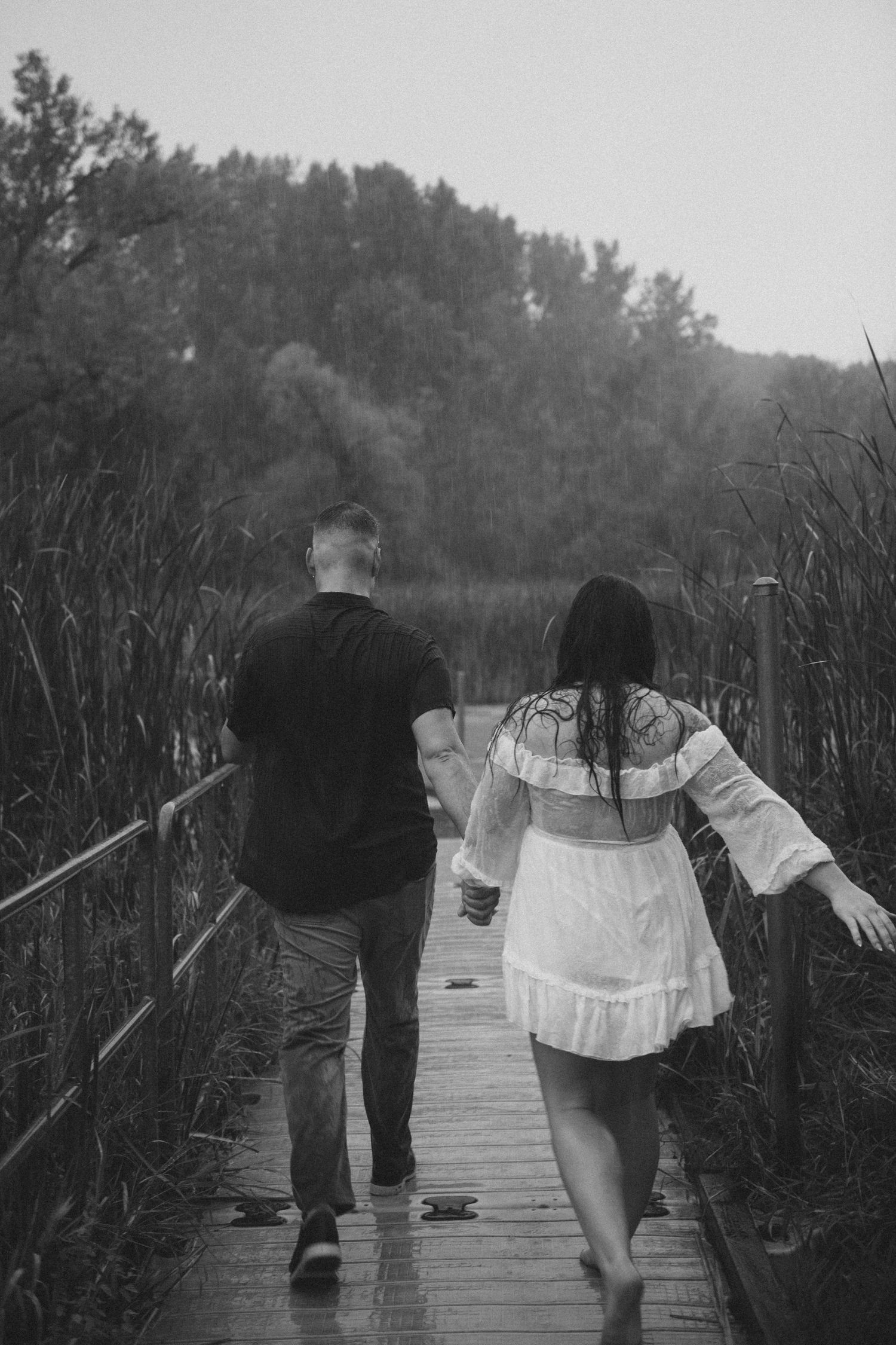 couple in engagement pictures on dock