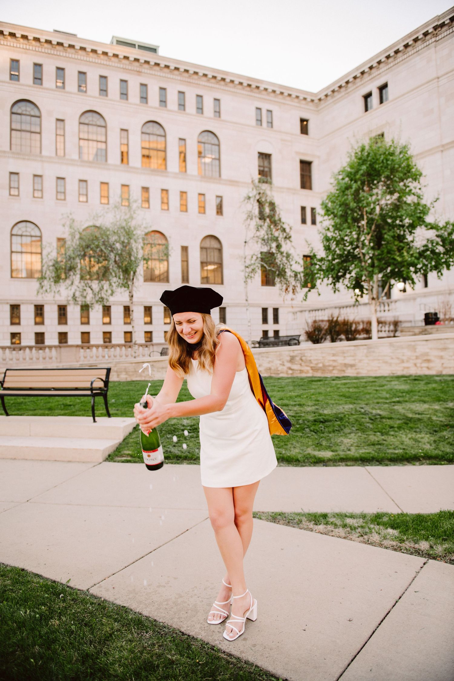 law school graduation photos popping champagne
