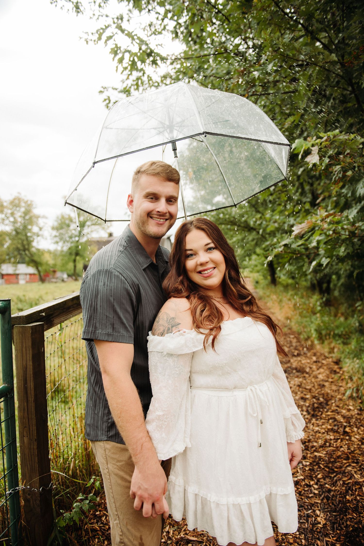 couple in engagement photos with umbrella