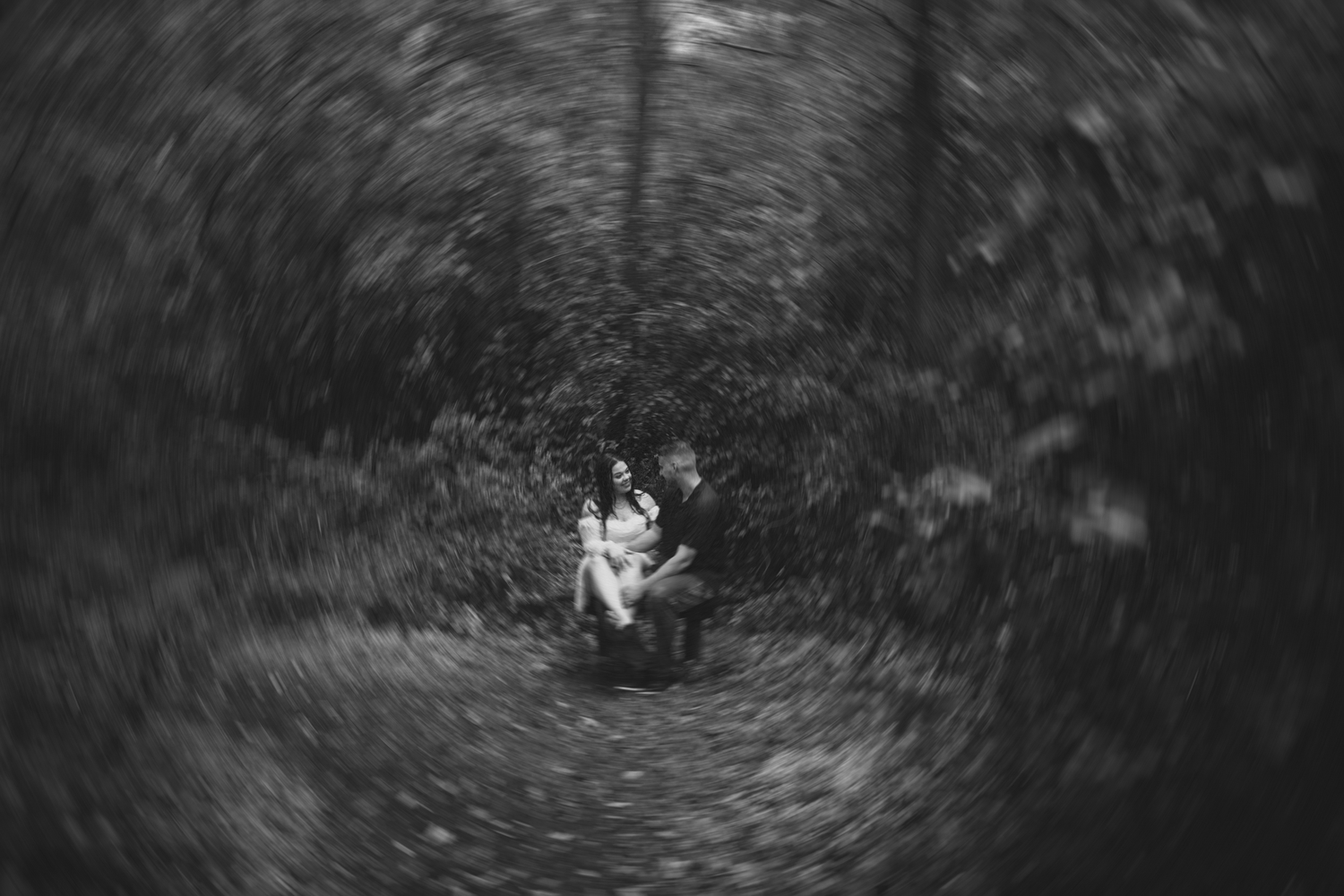 couple in engagement pictures in woods