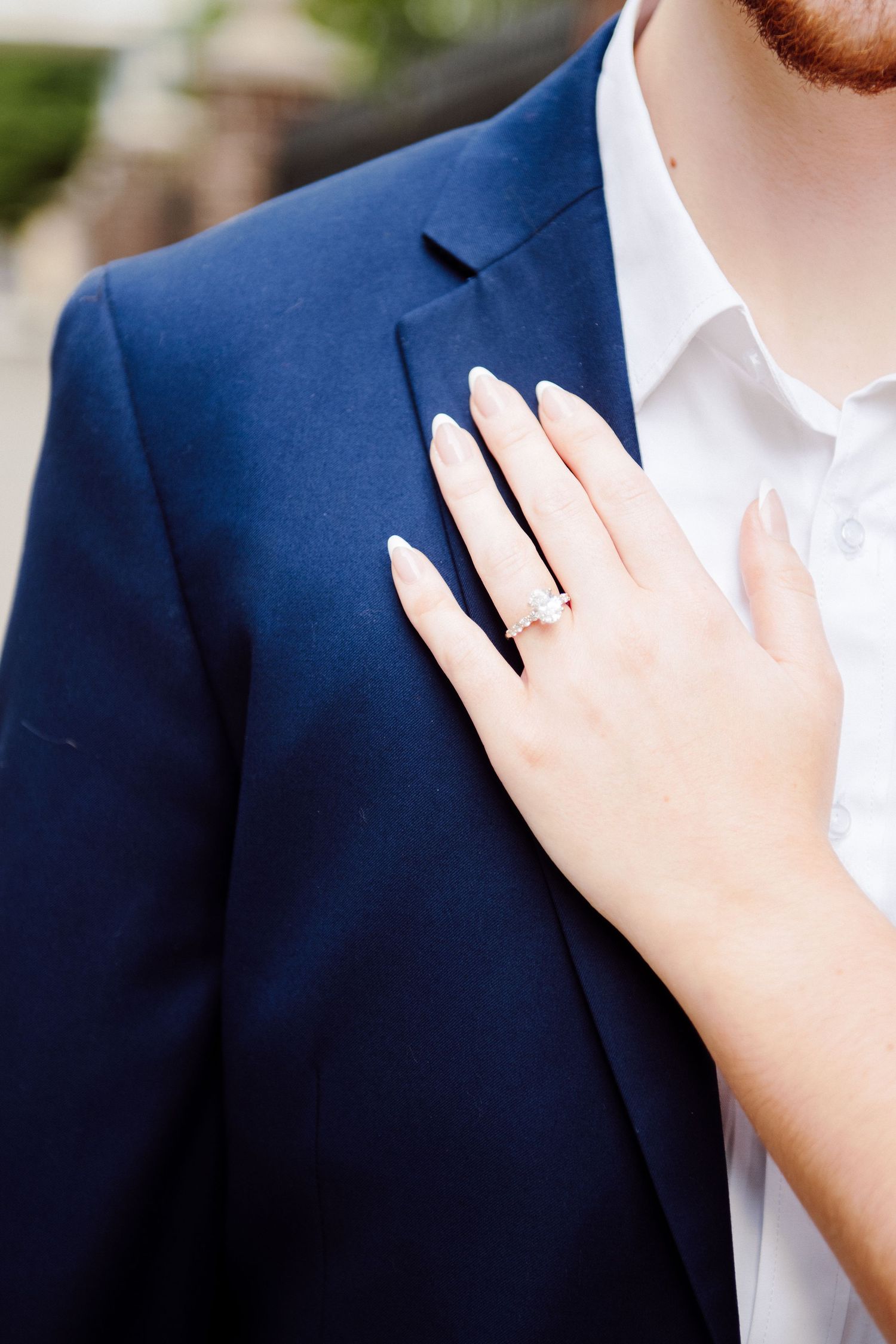 ring on hand on a shoulder