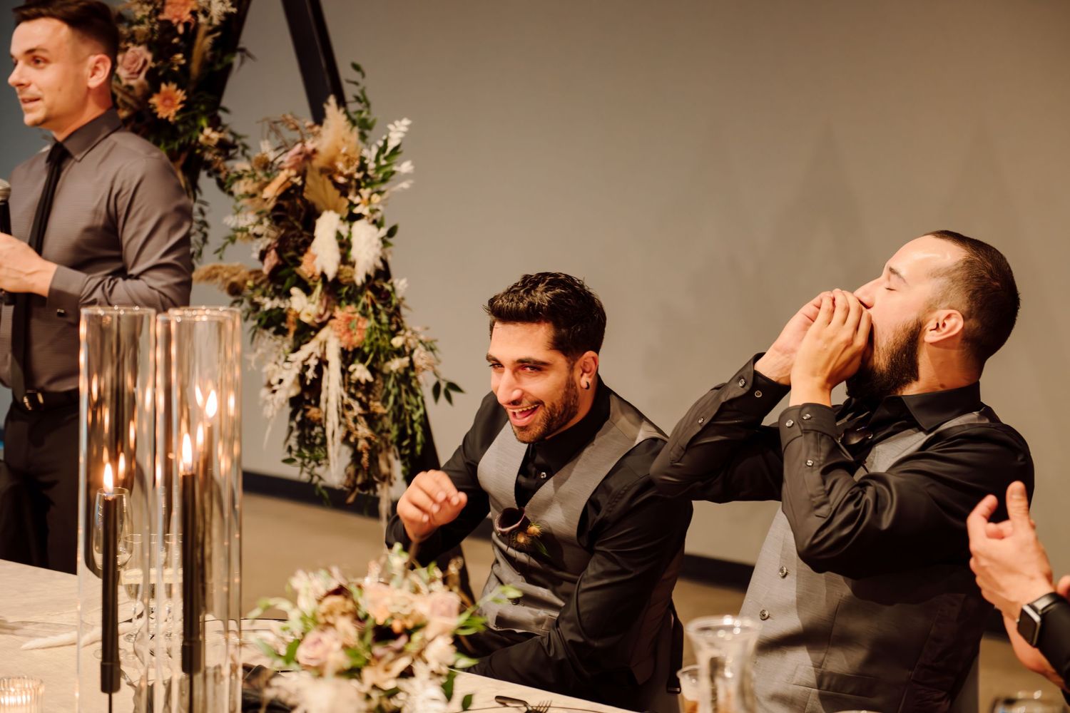 man giving speech at wedding reception