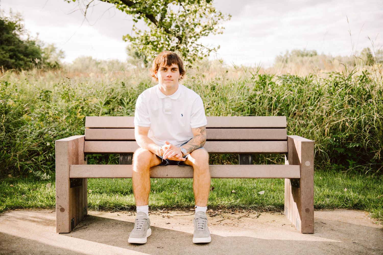 high school senior guy on bench