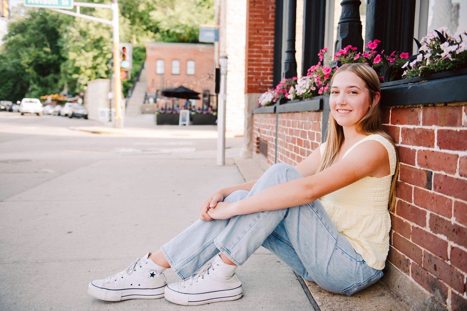 high school senior girl pictures leaning against wall