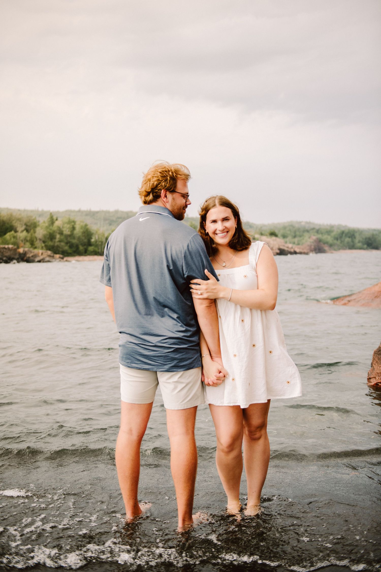 couple engagement pictures black sand beach