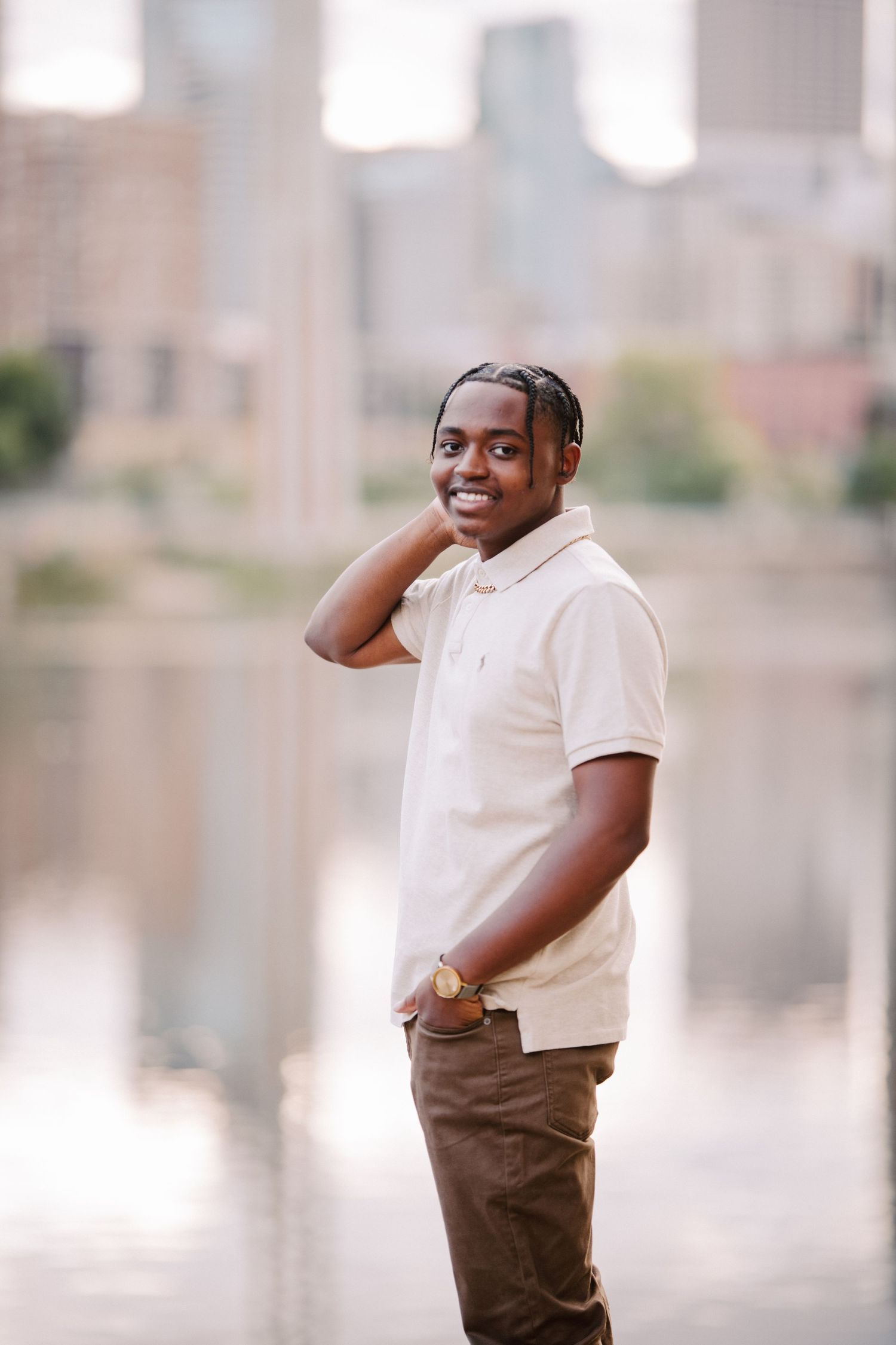 senior guy pictures in minneapolis standing on rock