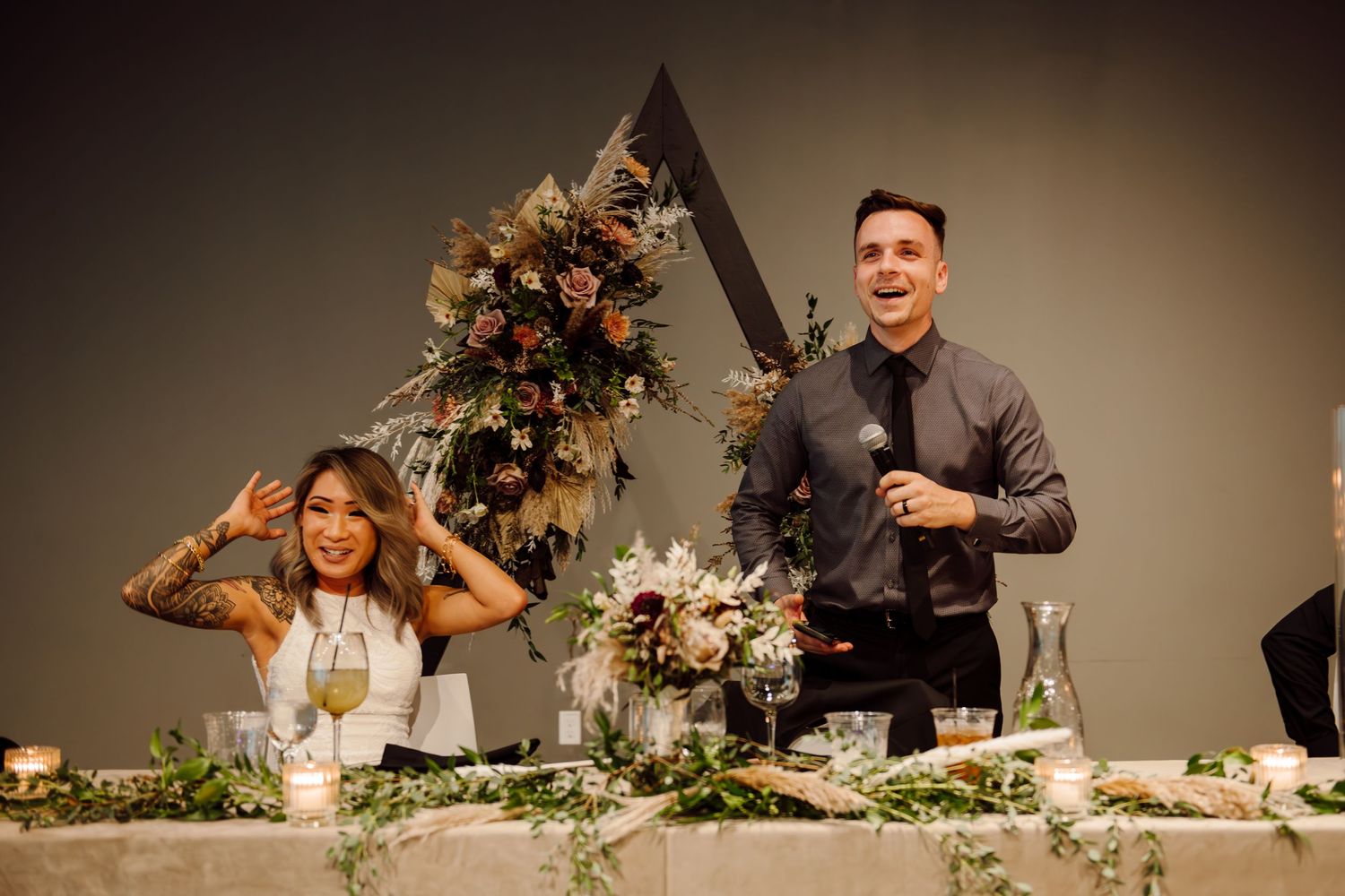 man giving speech at wedding reception