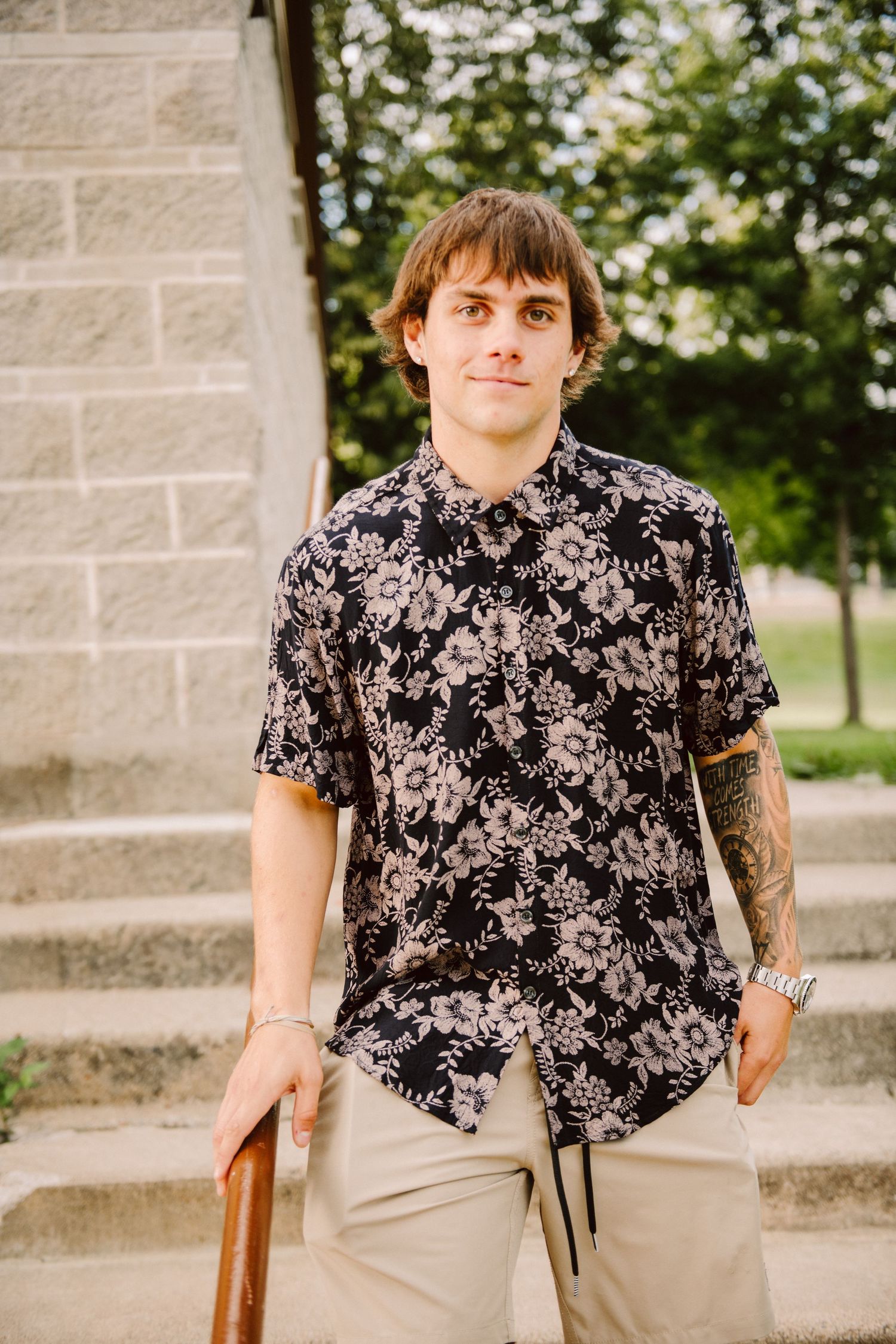 high school senior guy walking down stairs