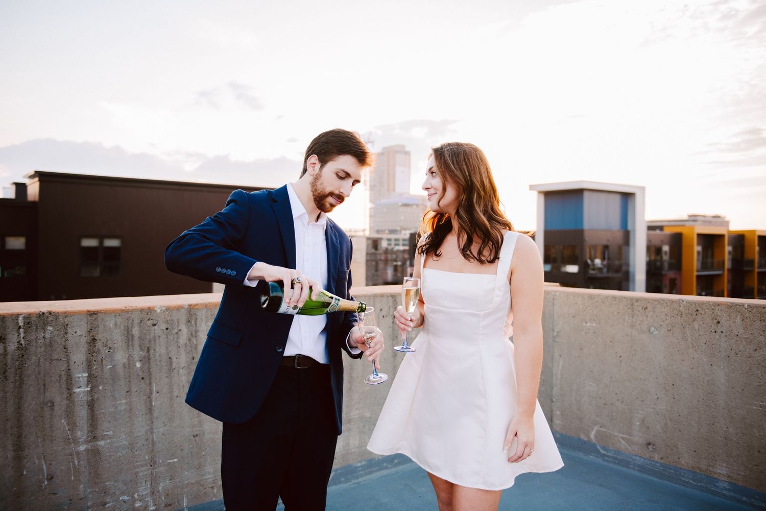 engagement pictures pouring champagne