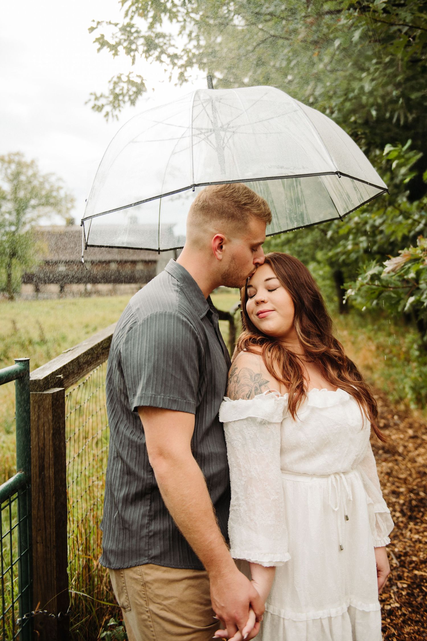 couple in engagement photos with umbrella