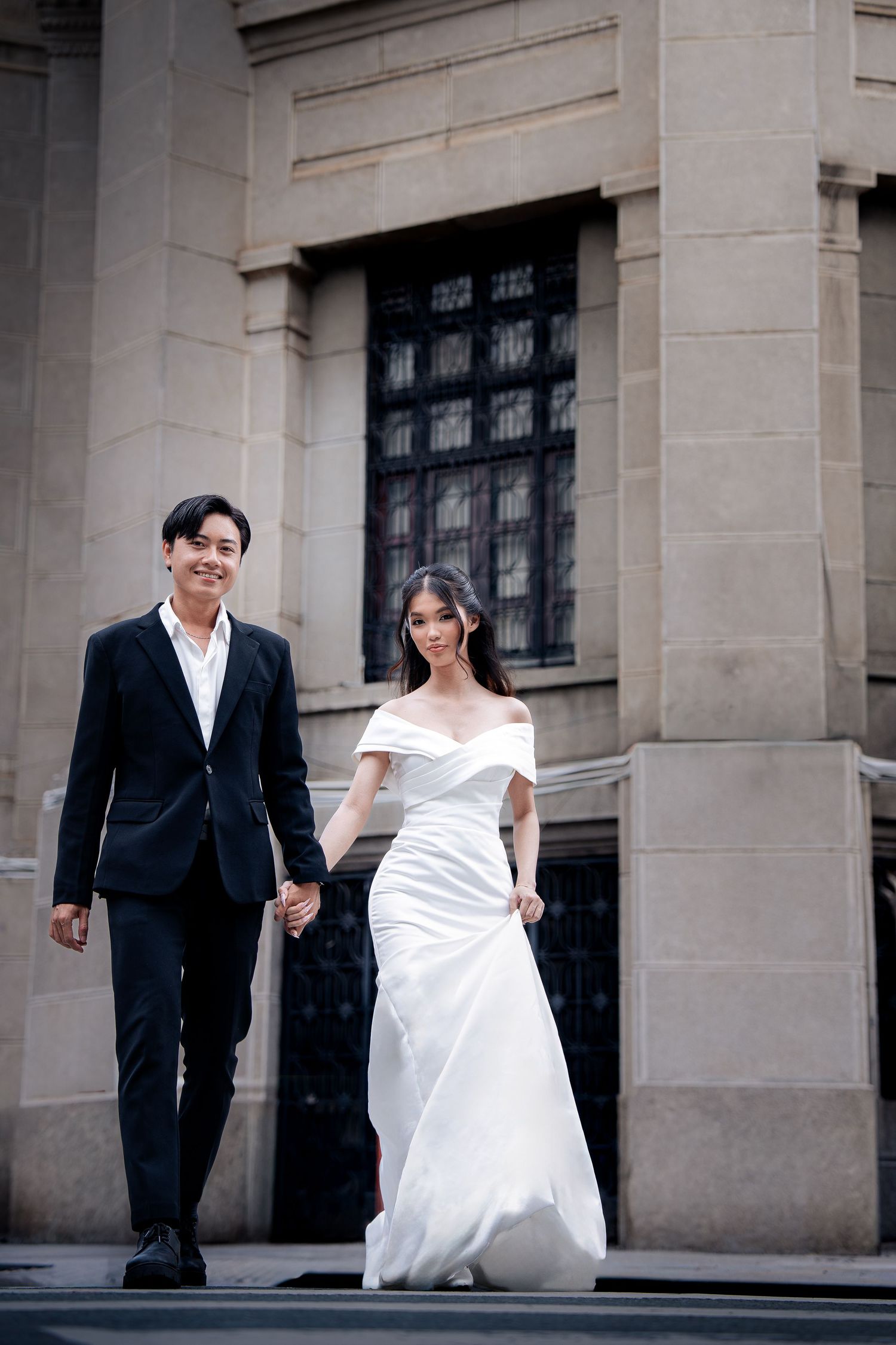 Elegant wedding photography series against classic stone architecture.