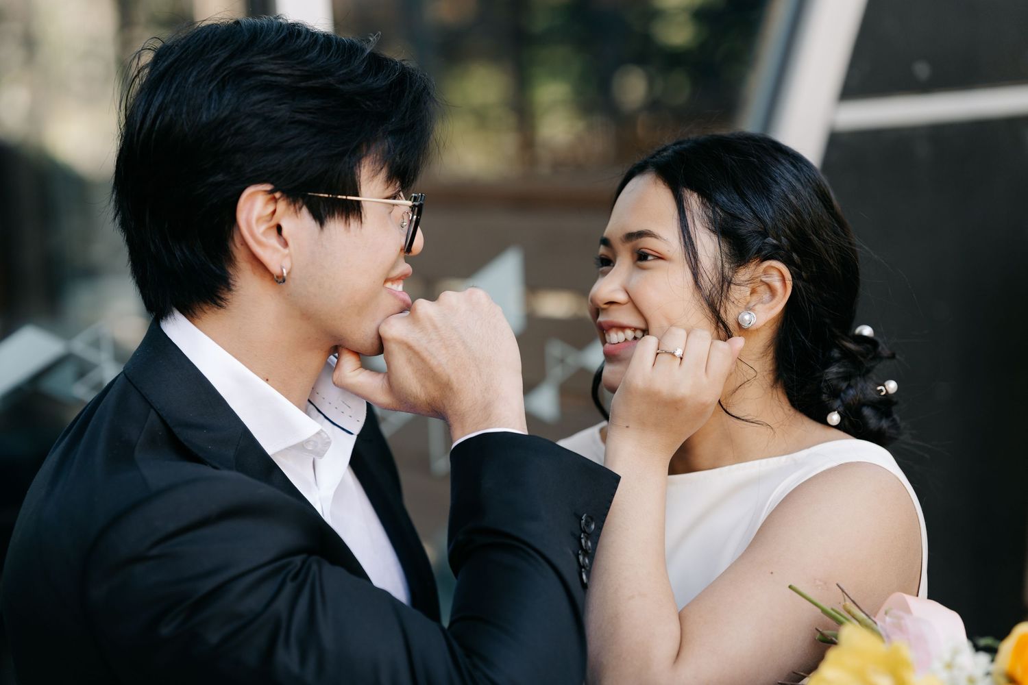 Close-up shots of a couple sharing intimate moments during their wedding photoshoot.