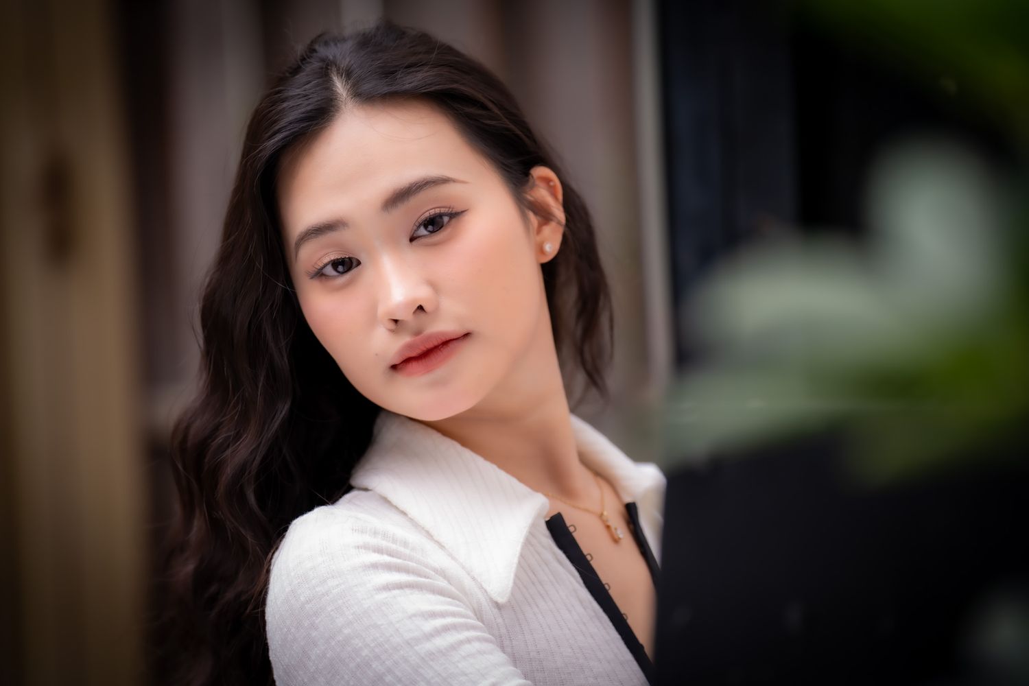 Artistic portrait series with soft lighting and natural makeup styling.