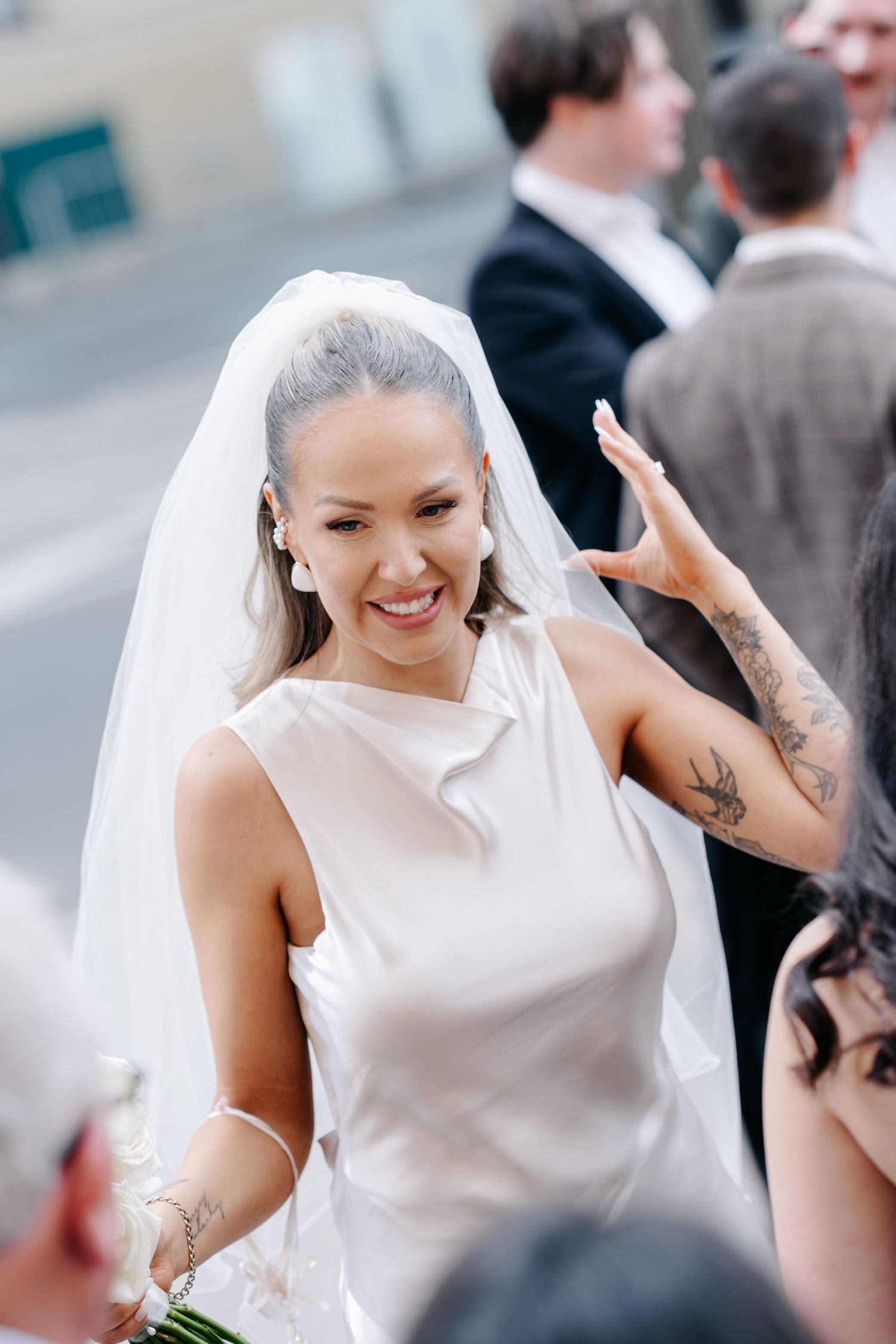 Candid shots of a bride's joyful laughter during wedding celebrations.