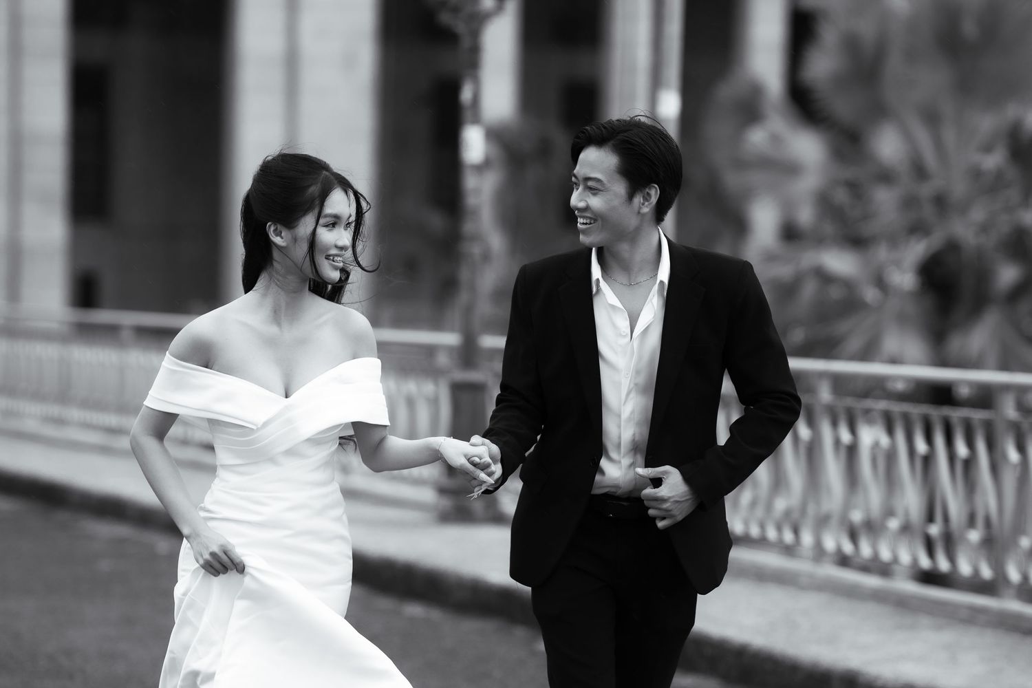Black and white wedding photography series showing couple in formal attire.