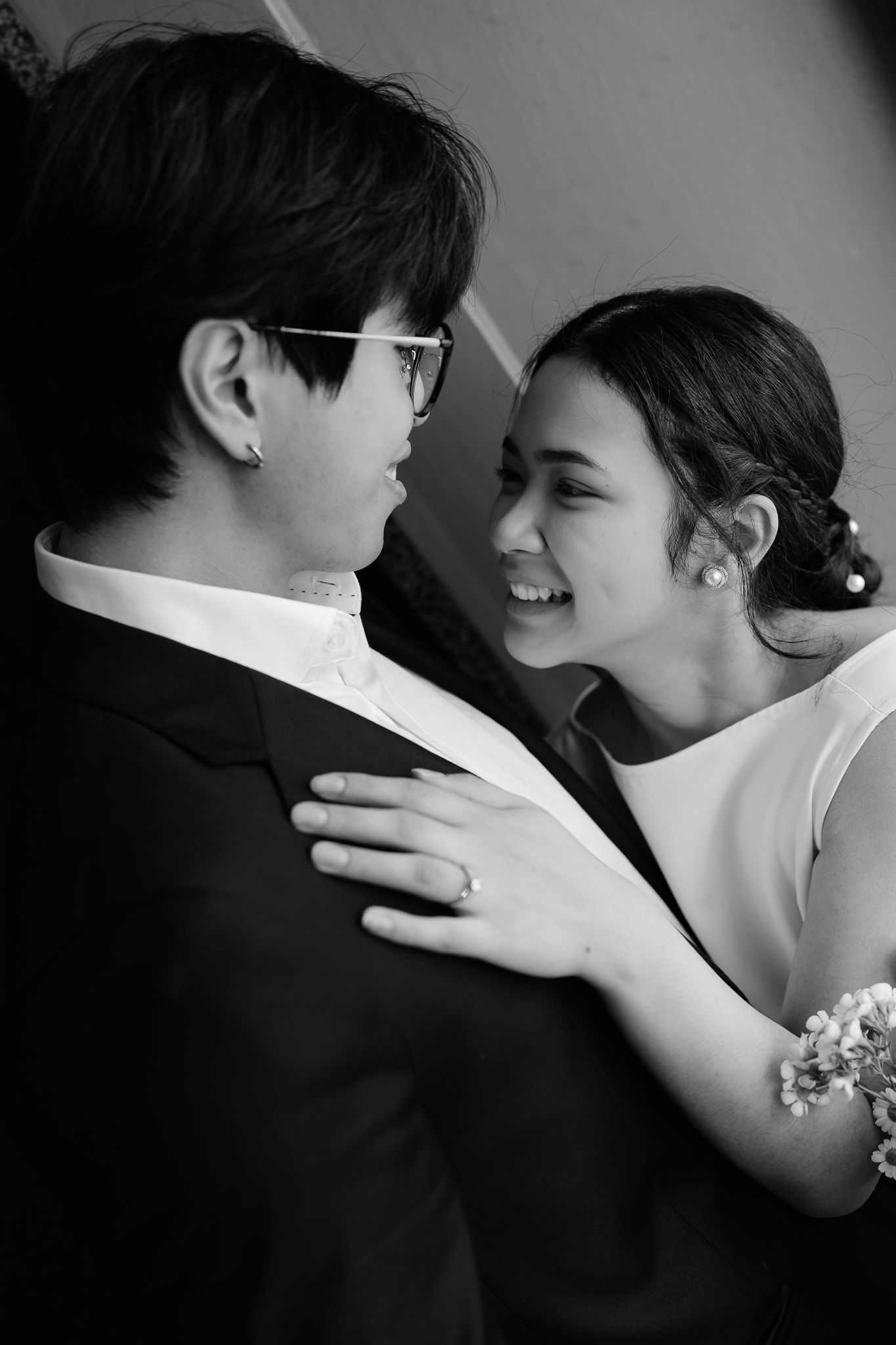 Black and white intimate portraits of a couple sharing tender moments.