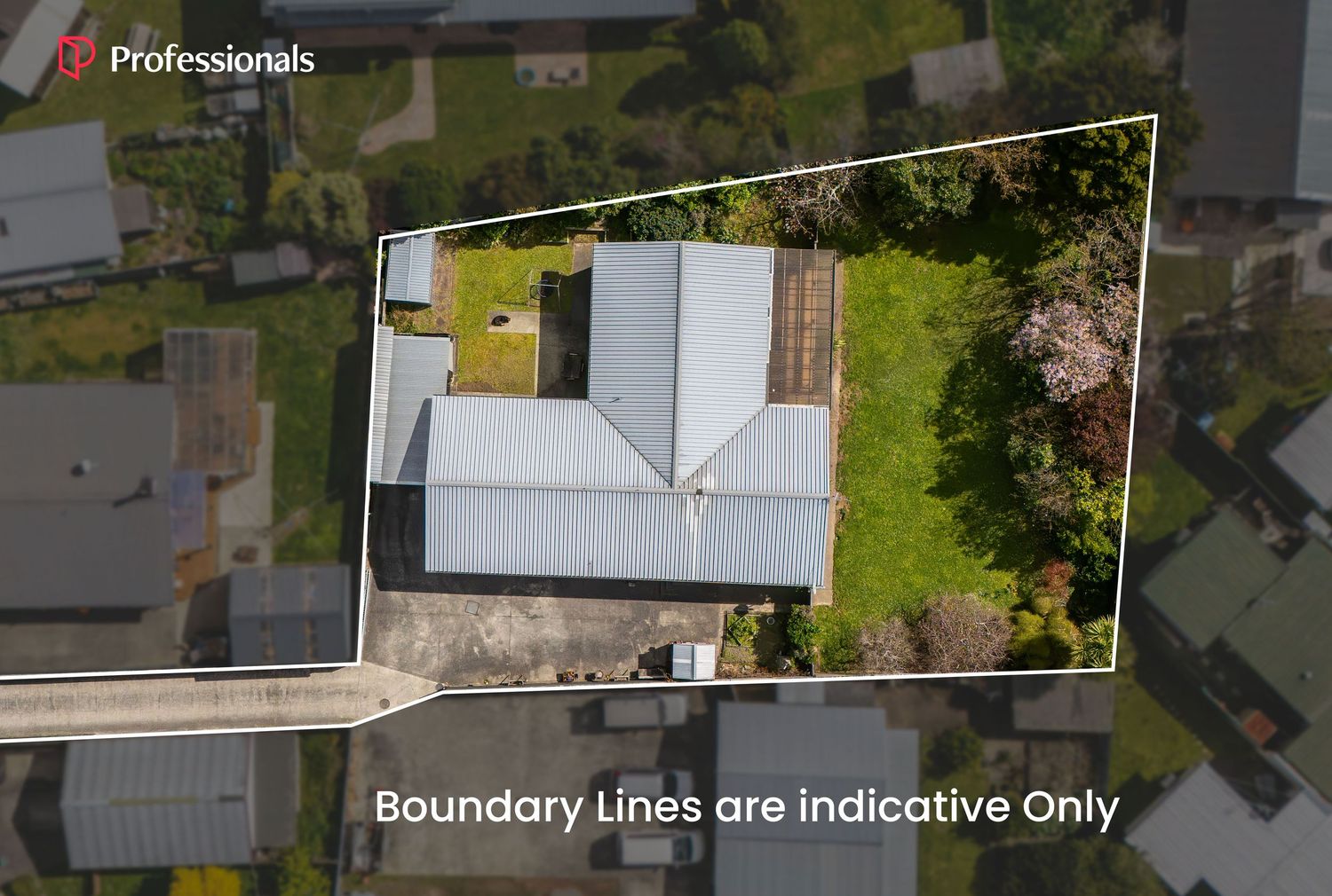 Aerial view of a residential property with boundary lines marked, showing a house with grey roof surrounded by gardens.