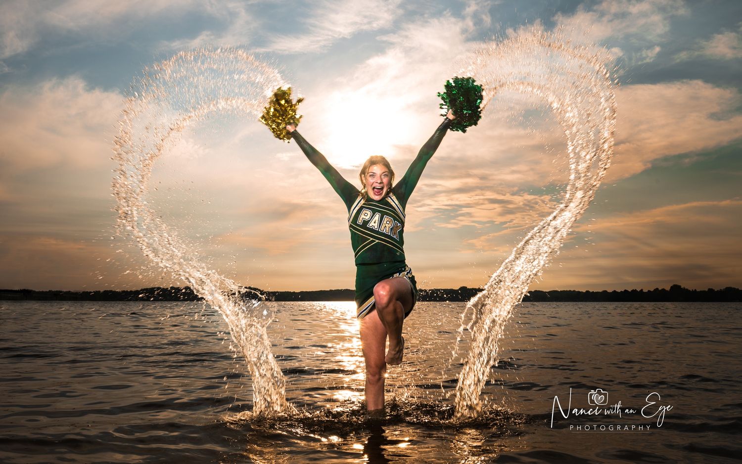 fun senior photoshoot cheerleader in the water splashing lake