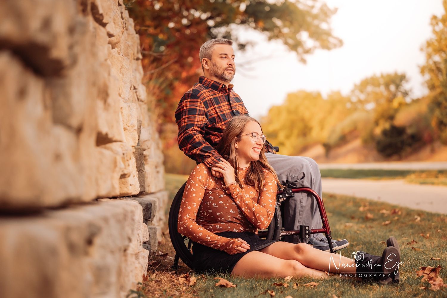 engagement photoshoot with wheelchair warm, dreamy, fall photography by concrete wall