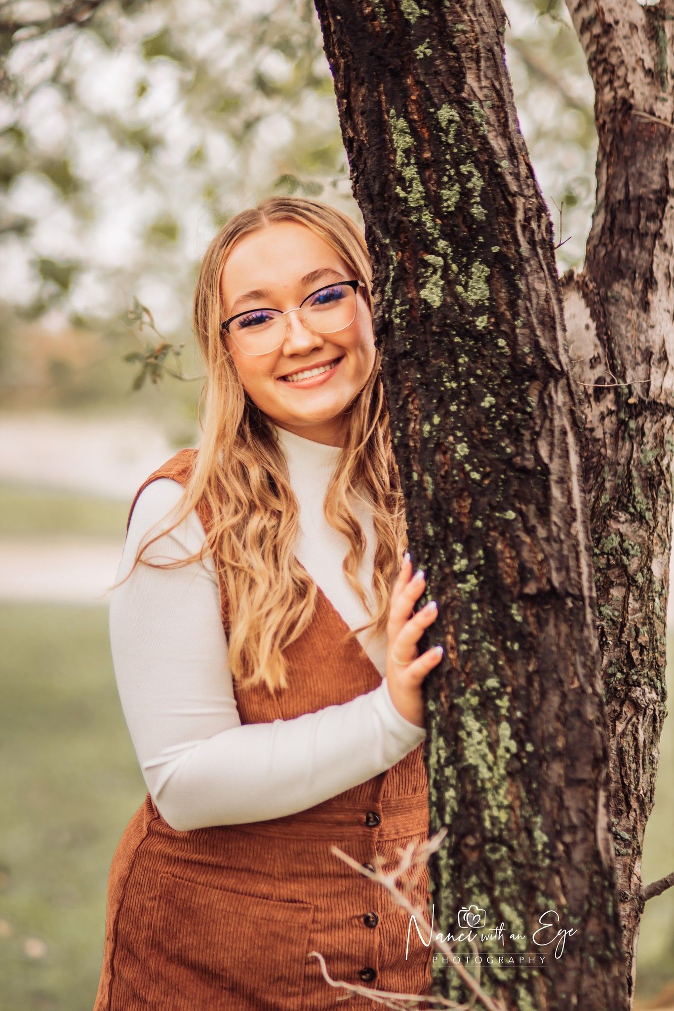 high school senior photo of girl next to tree