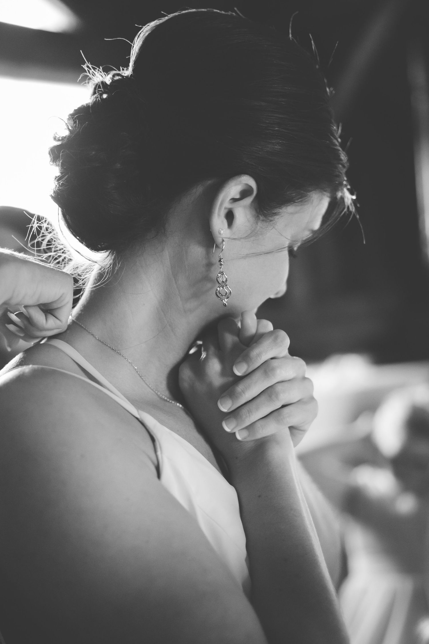 grayscale photo of bride holding her hands
