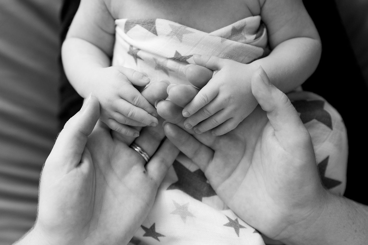 Black and white photo series of gentle hand gestures expressing tenderness and intimacy between two people.