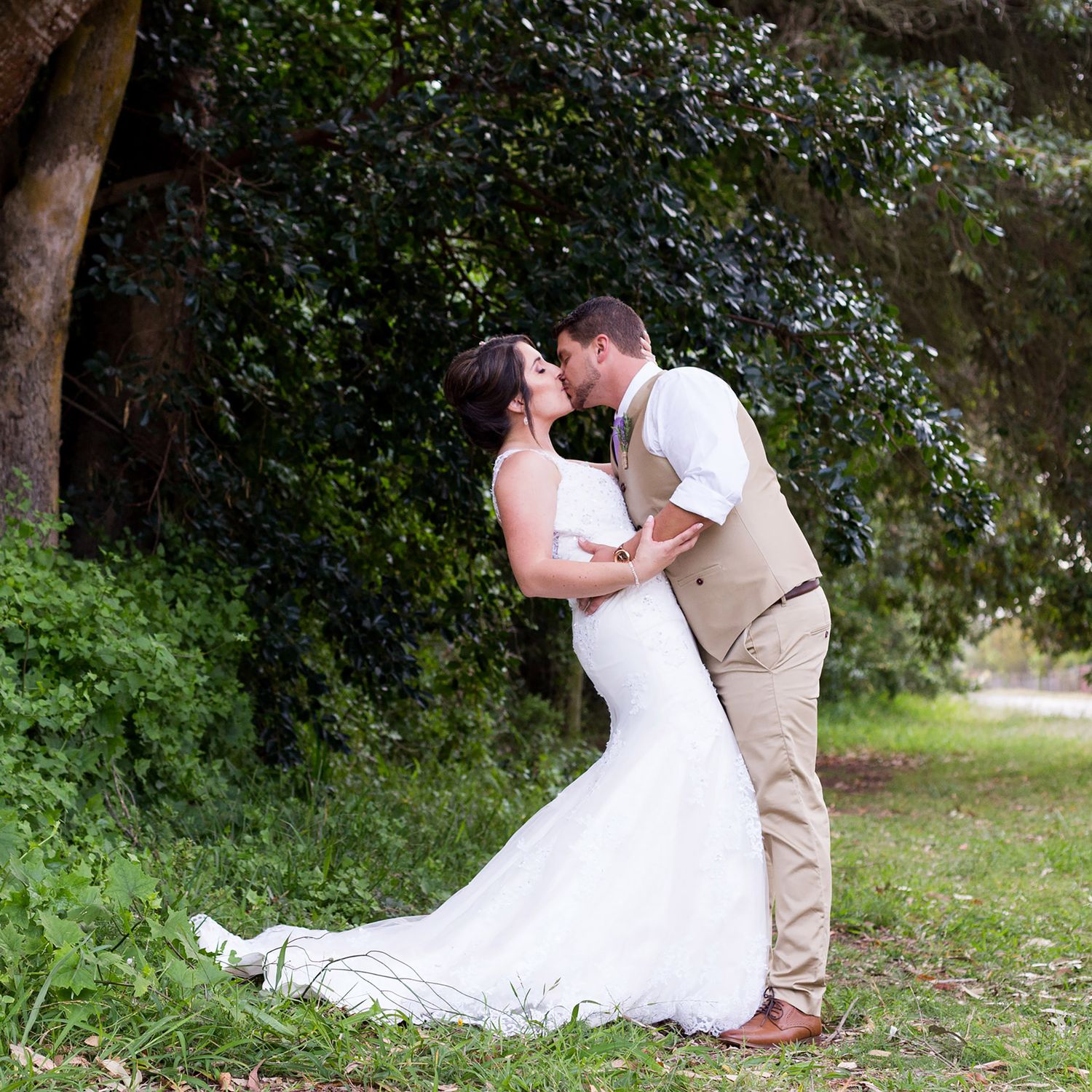 A series of romantic wedding photos showing a couple in white dress and tan suit embracing outdoors in a natural setting.