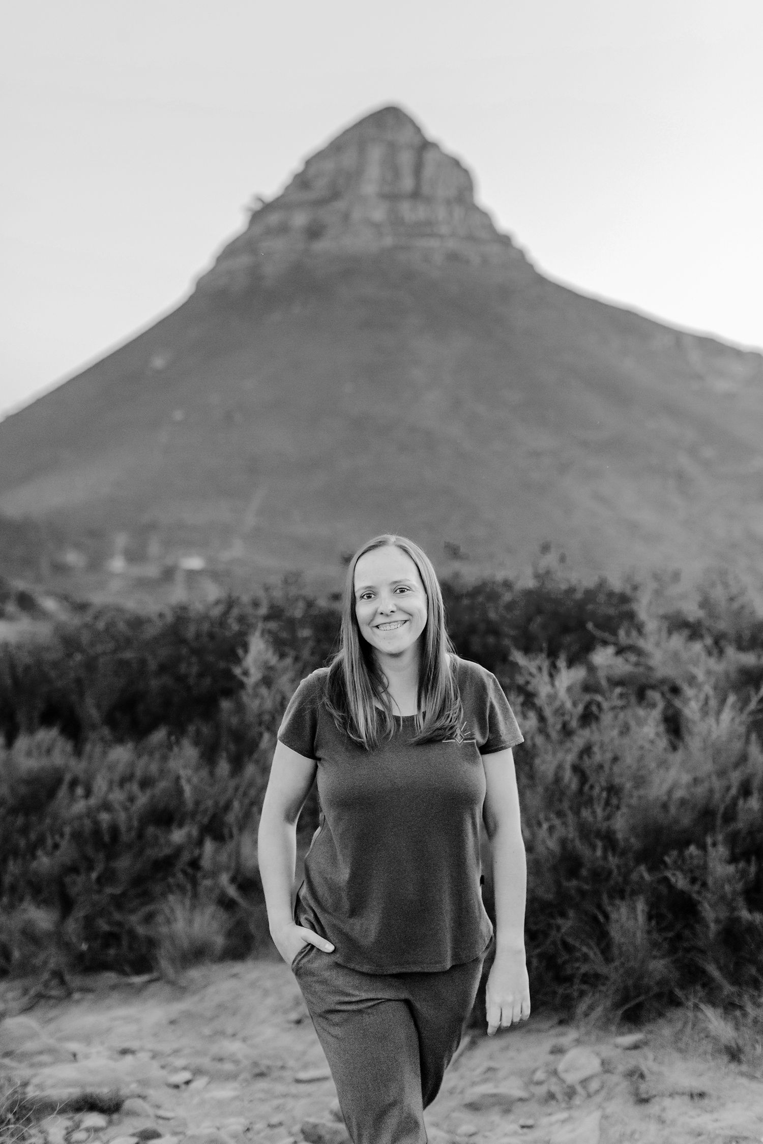 Sequence of black and white photos showing desert mountain landscape and figure in dark clothing in rugged terrain.