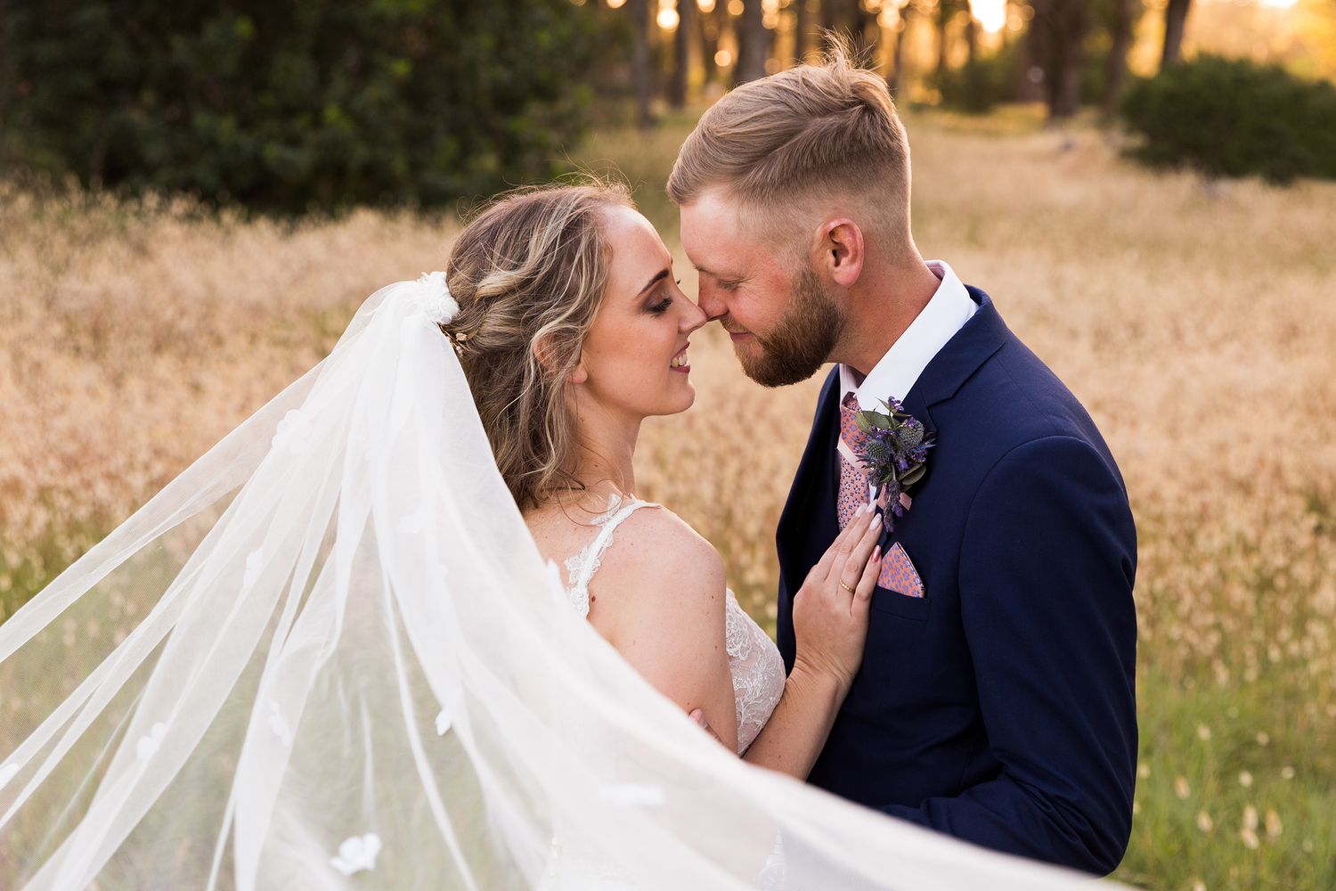 A romantic sunset wedding photoshoot showing couples embracing in a golden wheat field.