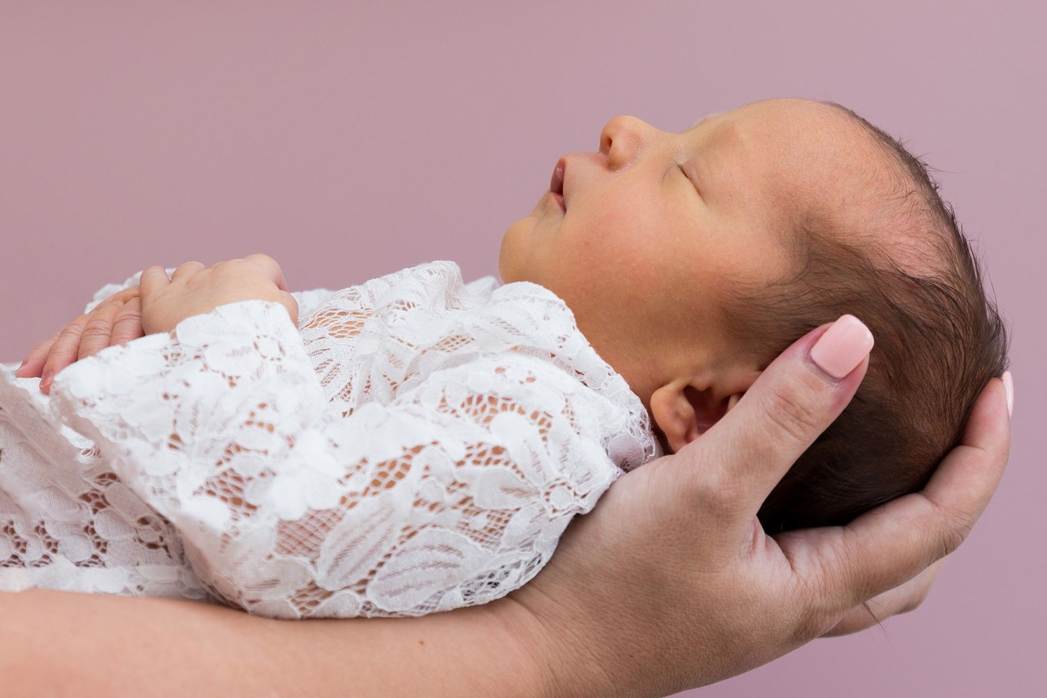 A series of photos showing sleeping babies in white lace fabric arranged in a peaceful sleeping position.