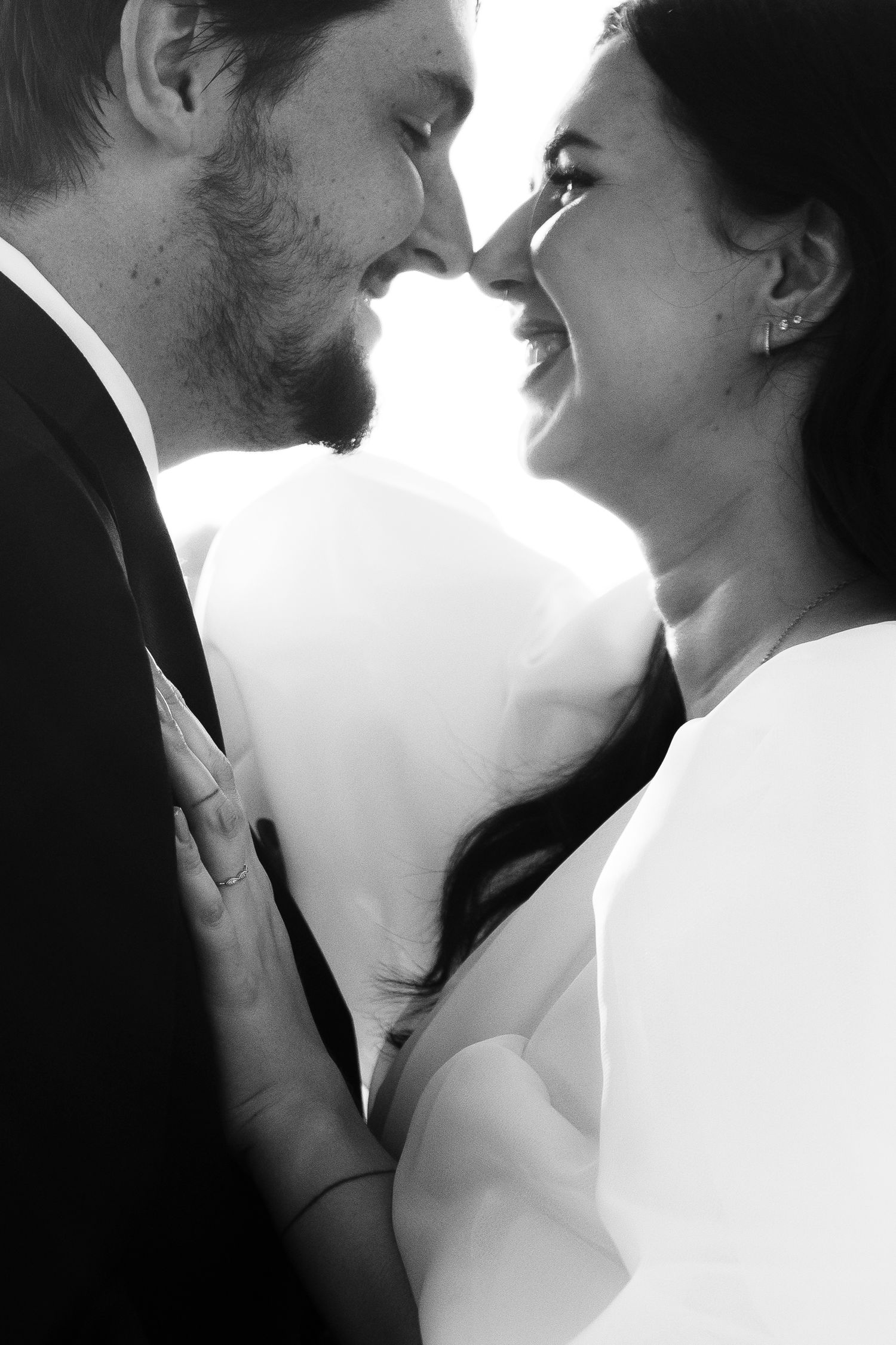 Artistic black and white close-up portraits capturing intimate wedding moments.