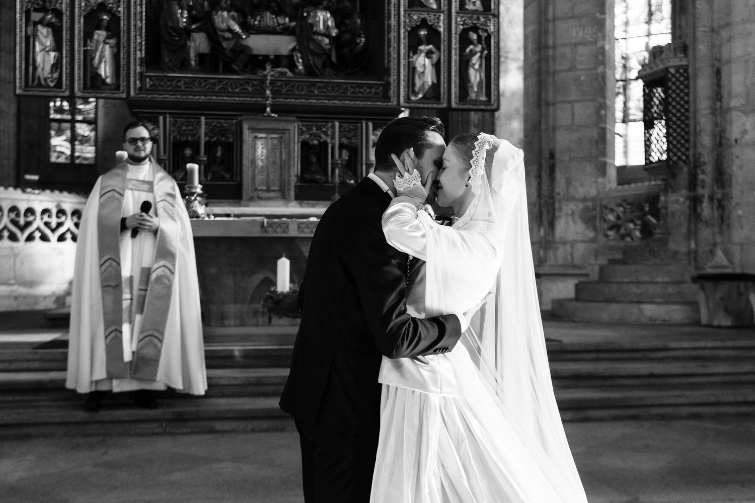 A series of black and white photos showing a couple in formal attire dancing in an elegant indoor venue.