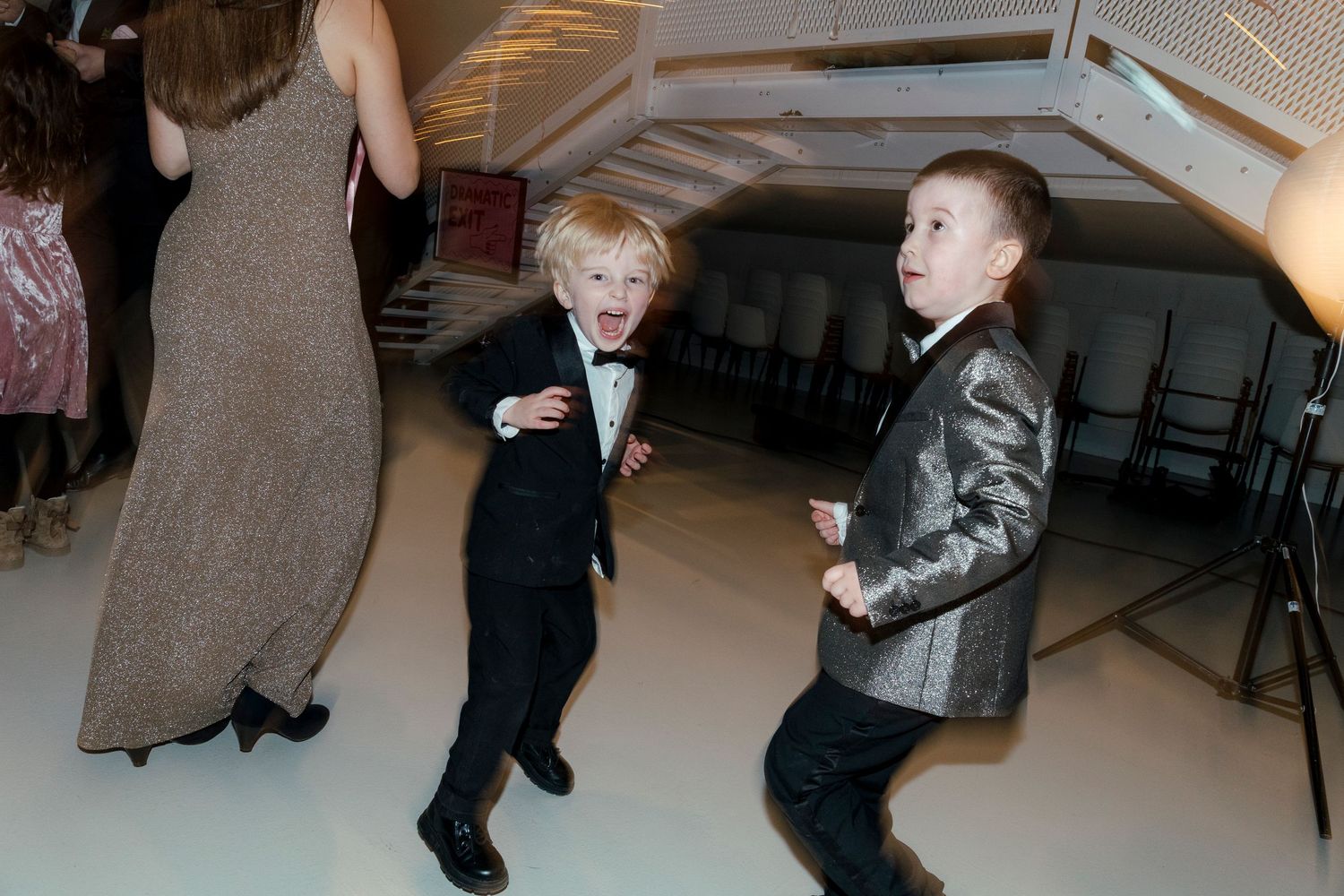 Young children dancing and having fun at a reception party.