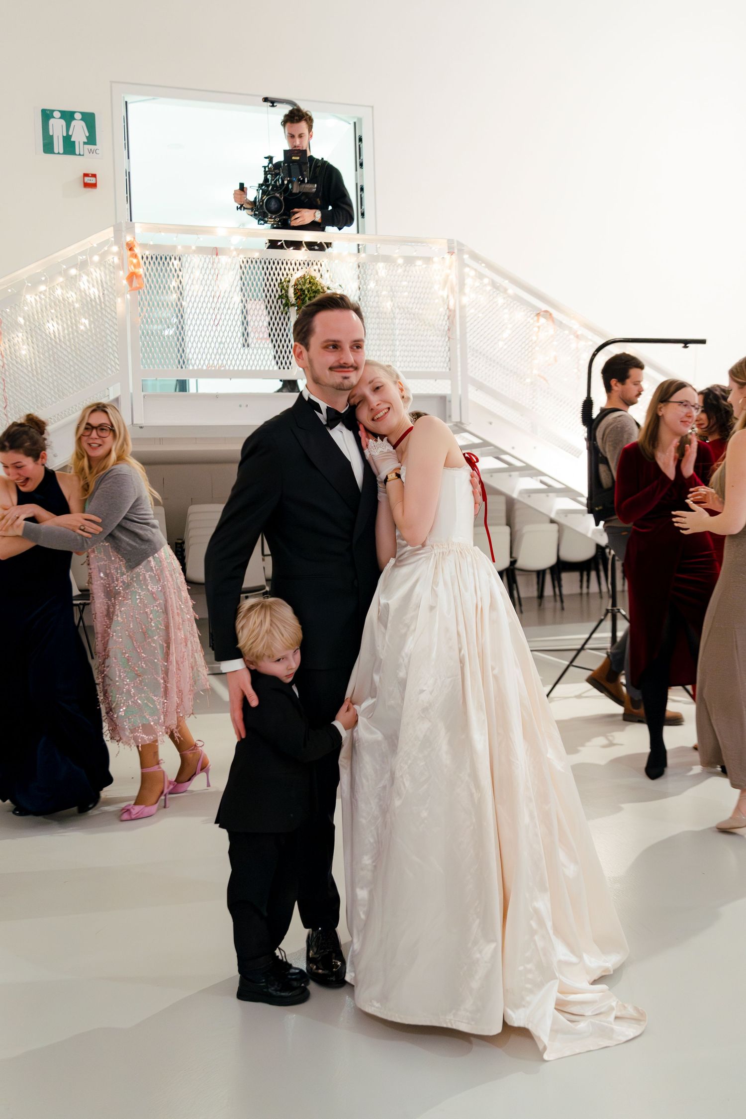 A sequence of wedding dance photos showing a couple sharing tender moments on the dance floor in a bright reception venue.
