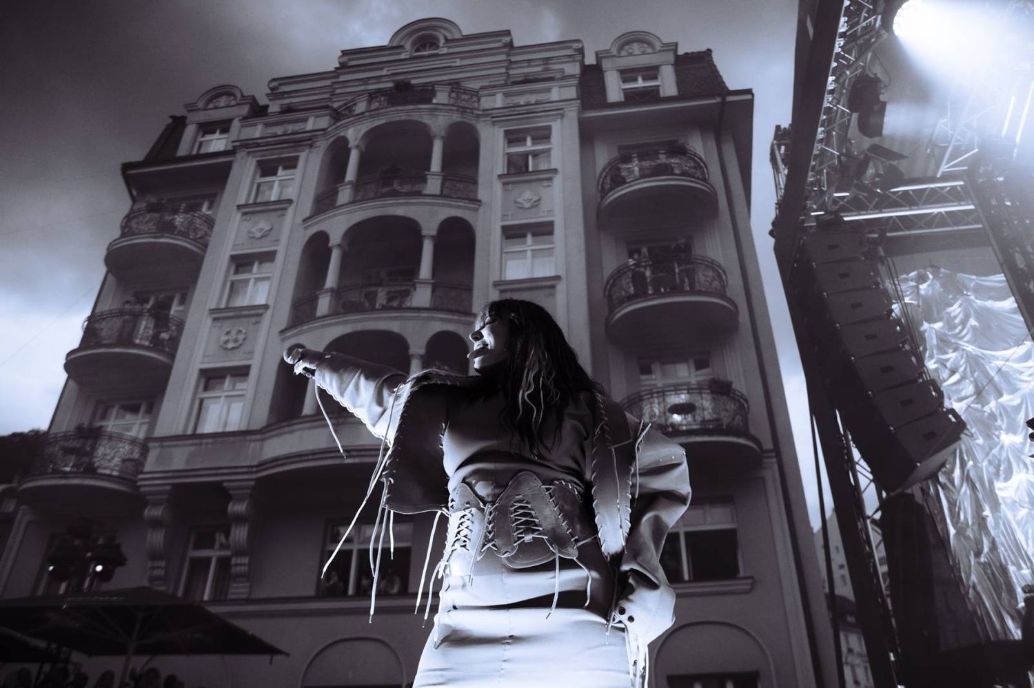Dramatic black and white architectural photos of ornate Victorian buildings with detailed facades and bay windows.