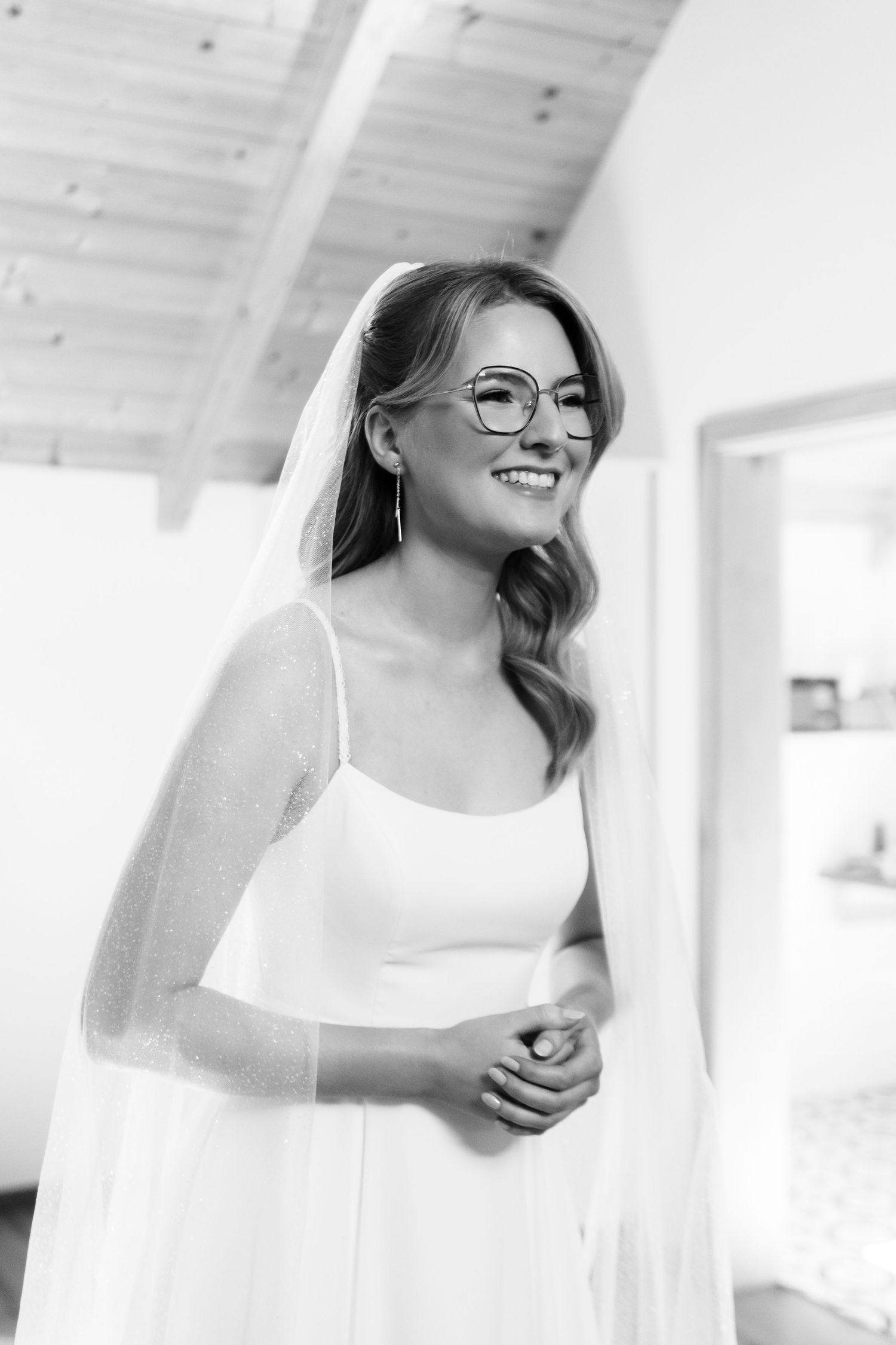 Black and white portrait series showing joyful expressions in natural light.