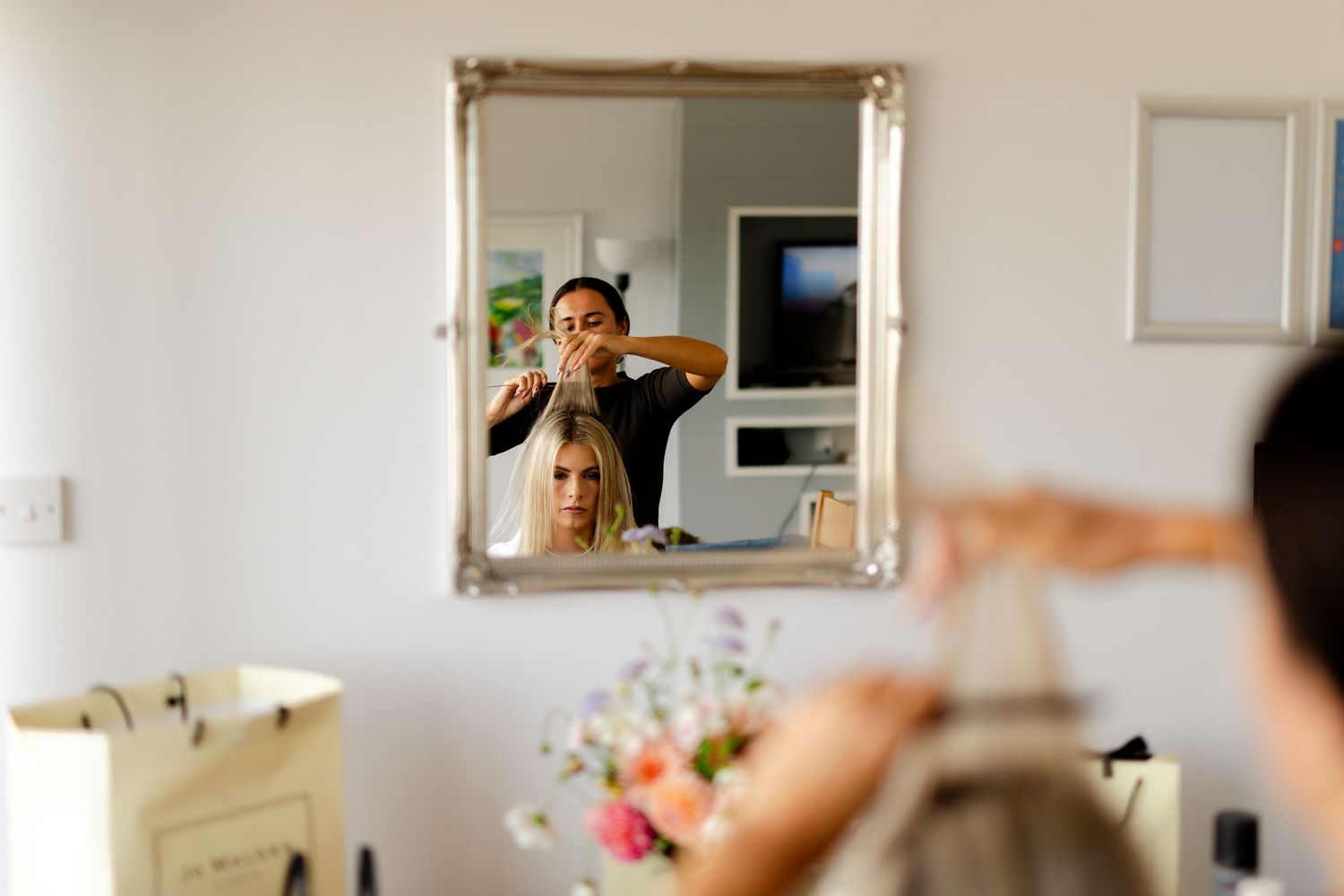 A sequence of bathroom selfies with someone posing and playfully making faces in a mirror.