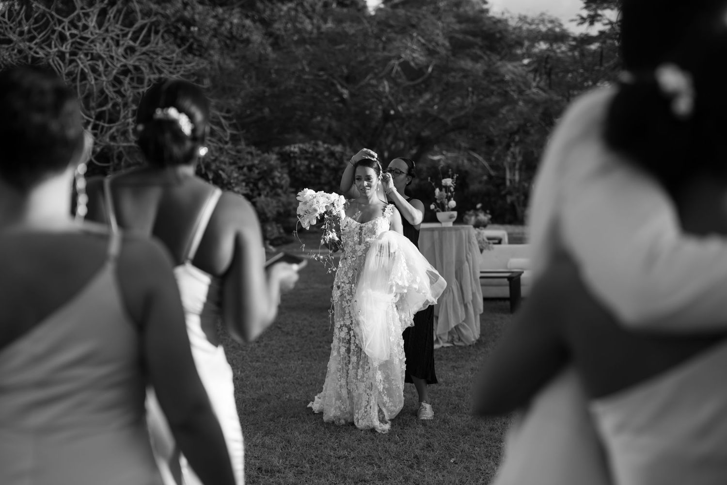 Black and white sequence of candid dancing photos capturing a joyful celebration at an outdoor wedding reception.