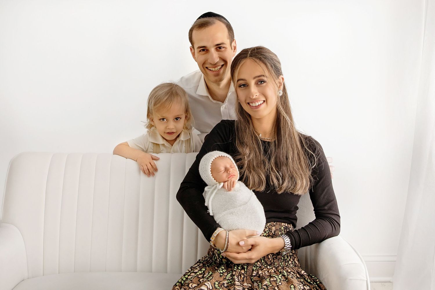 Family of four together during family photography in New Jersey