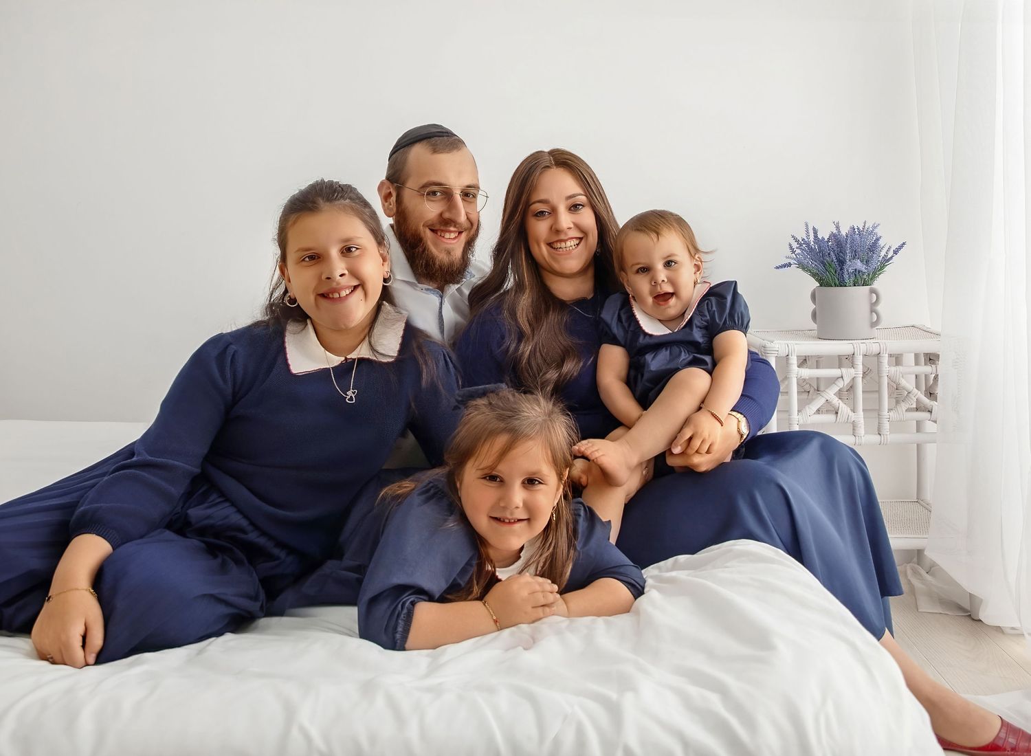 Smiling family portrait with parents and children in Lakewood NJ family photography session