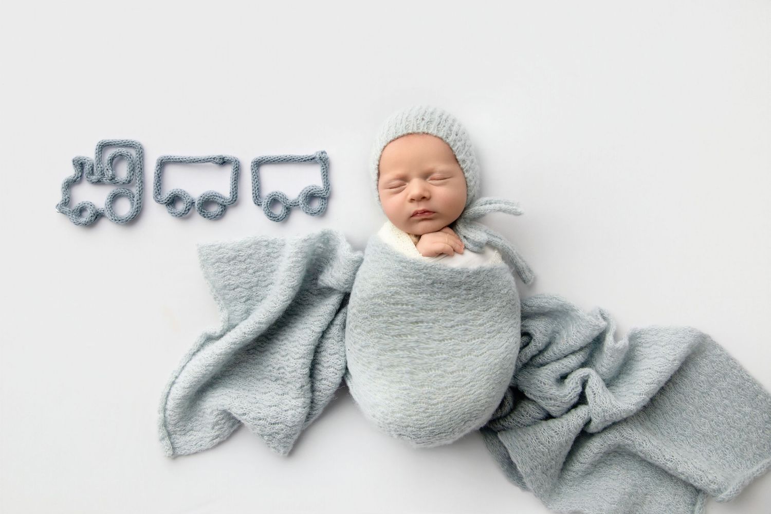 newborn photoshoot of sleeping baby, soft infant photography setup