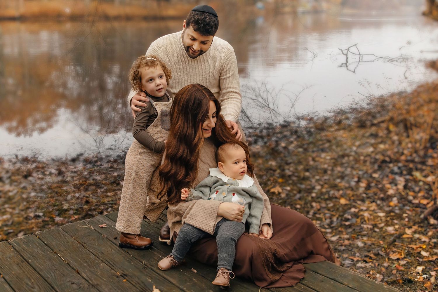Family playing together during fall outdoor family photography session in New Jersey